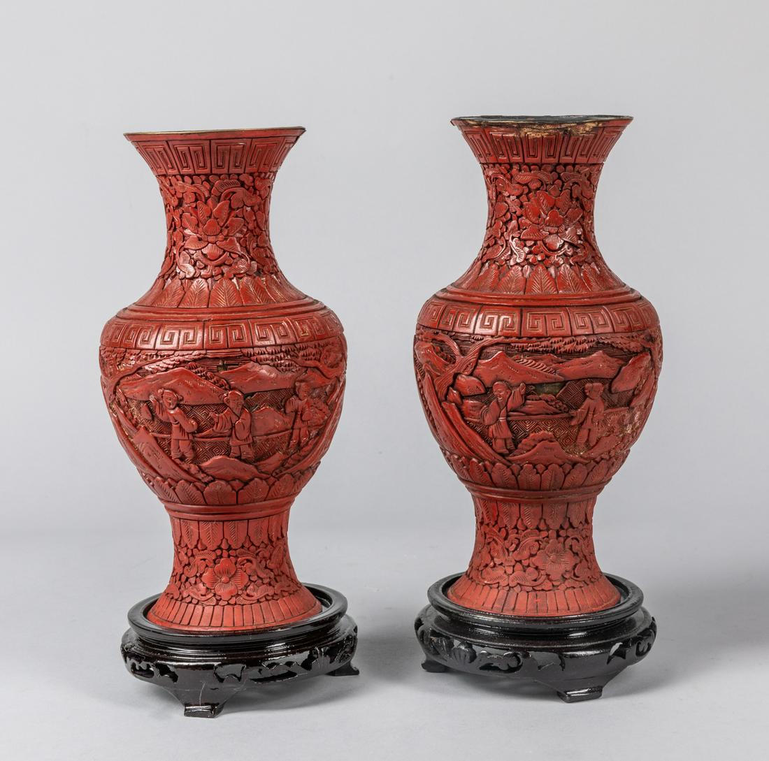 Pair of Chinese Antique Cinnabar Vases: Pair of Chinese cinnabar vases of landscape decoration, with wood stands. Minor chips, 1850-1900. 8.5 inch H (without stands)