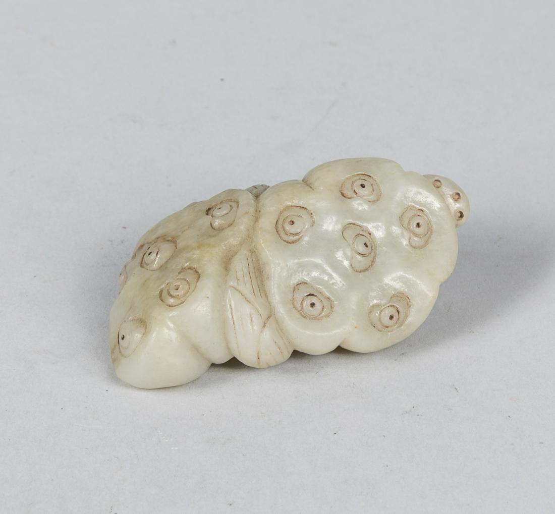 18-19th Chinese Antique Carved White Jade Lotus: The two adjacent pods borne on leafy stems issuing leaves on the side, the stone of white tone with russet inclusions. 2.79*1.51 inch