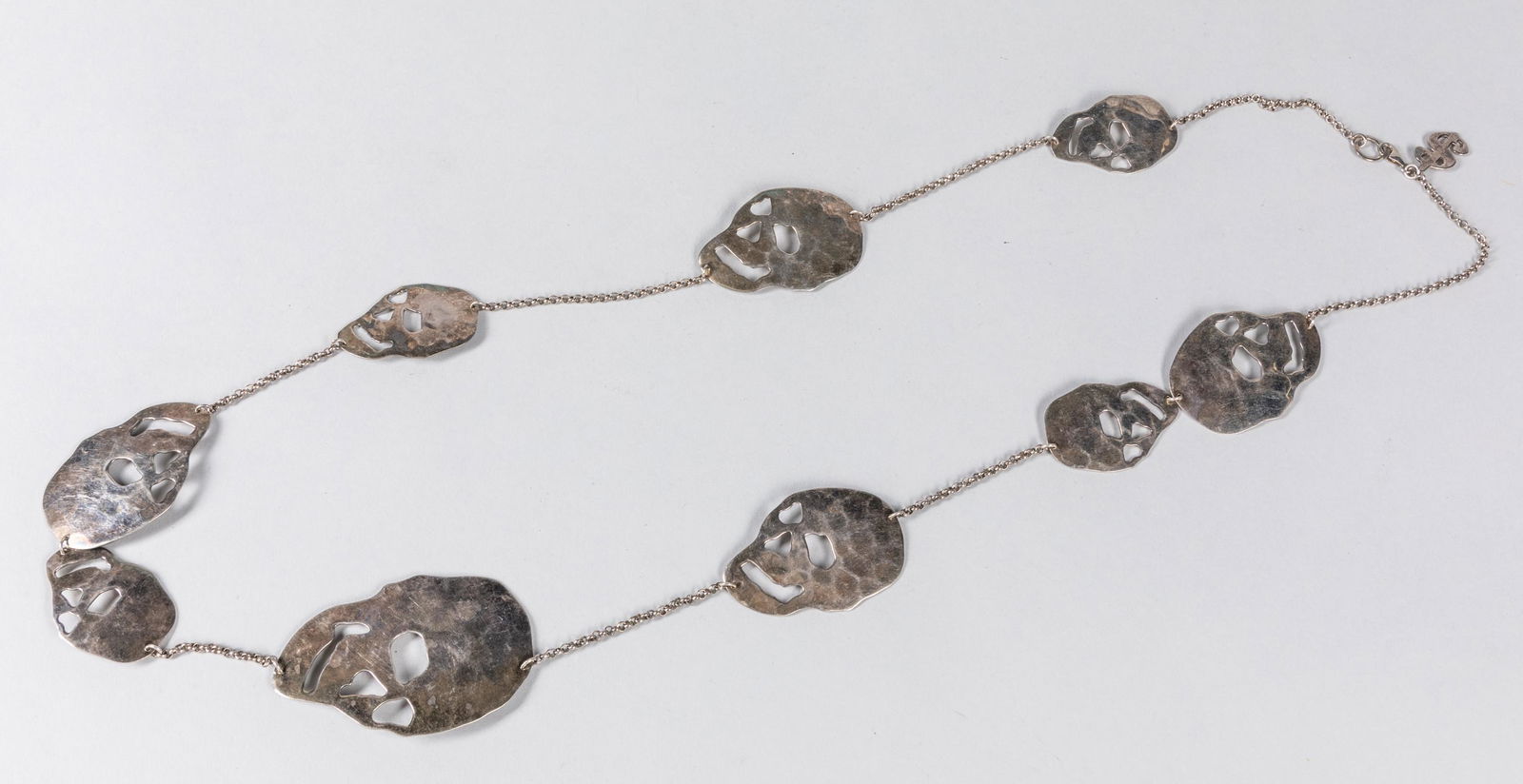 Signed Andy Warhol Collection Sterling Silver Necklace: Robert Lee Morris â€˜Skull Station Jewelry, stamped c/r/TM the Andy Warhol Collection 925, engraved famous Andy Warhol Quotes.