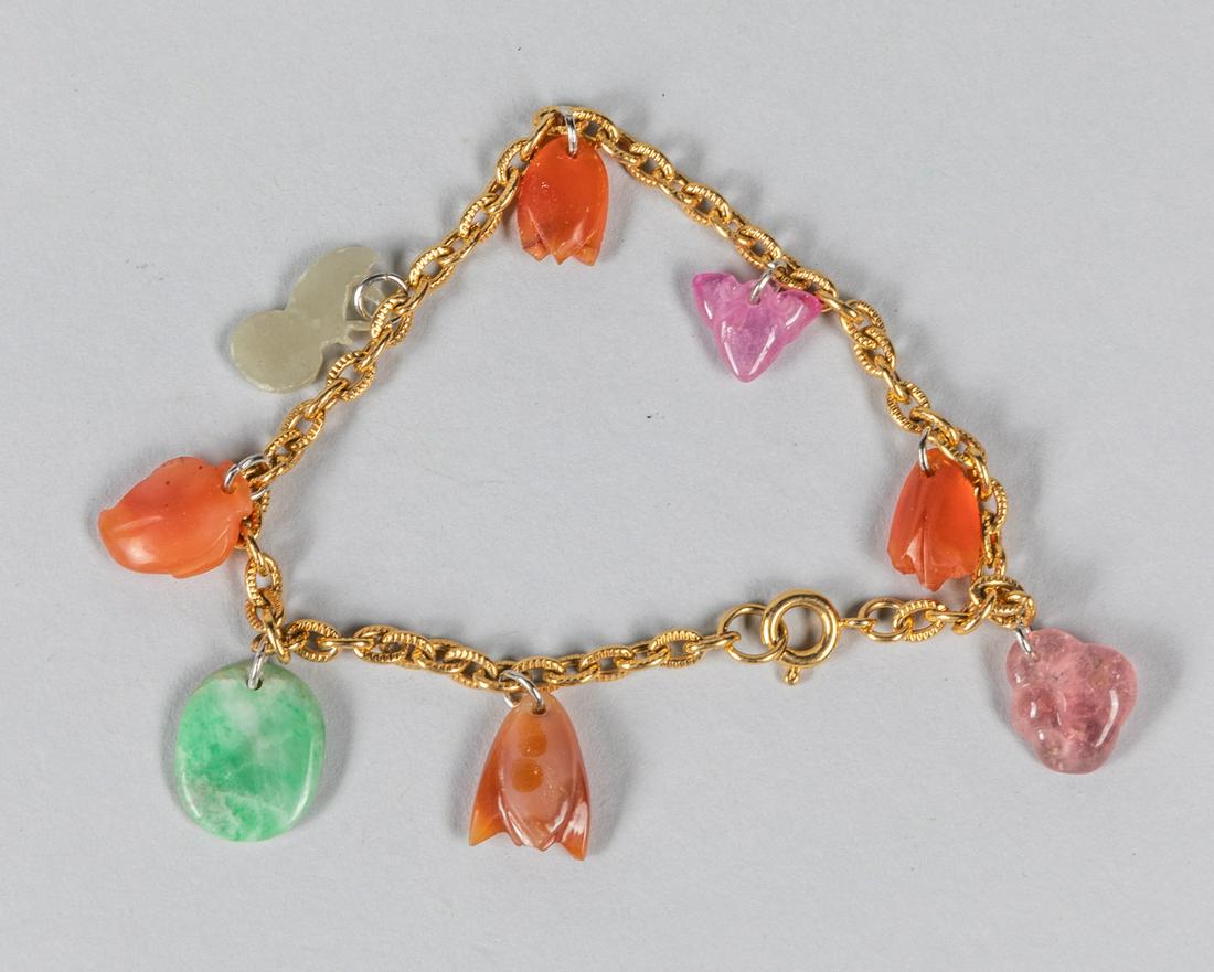 Hong Kong Export Jade & Tourmaline Bracelet: Hong Kong 1970-1980 export bracelet composed by carved antique agate, tourmaline, jade & jadeite. 3 inch D.