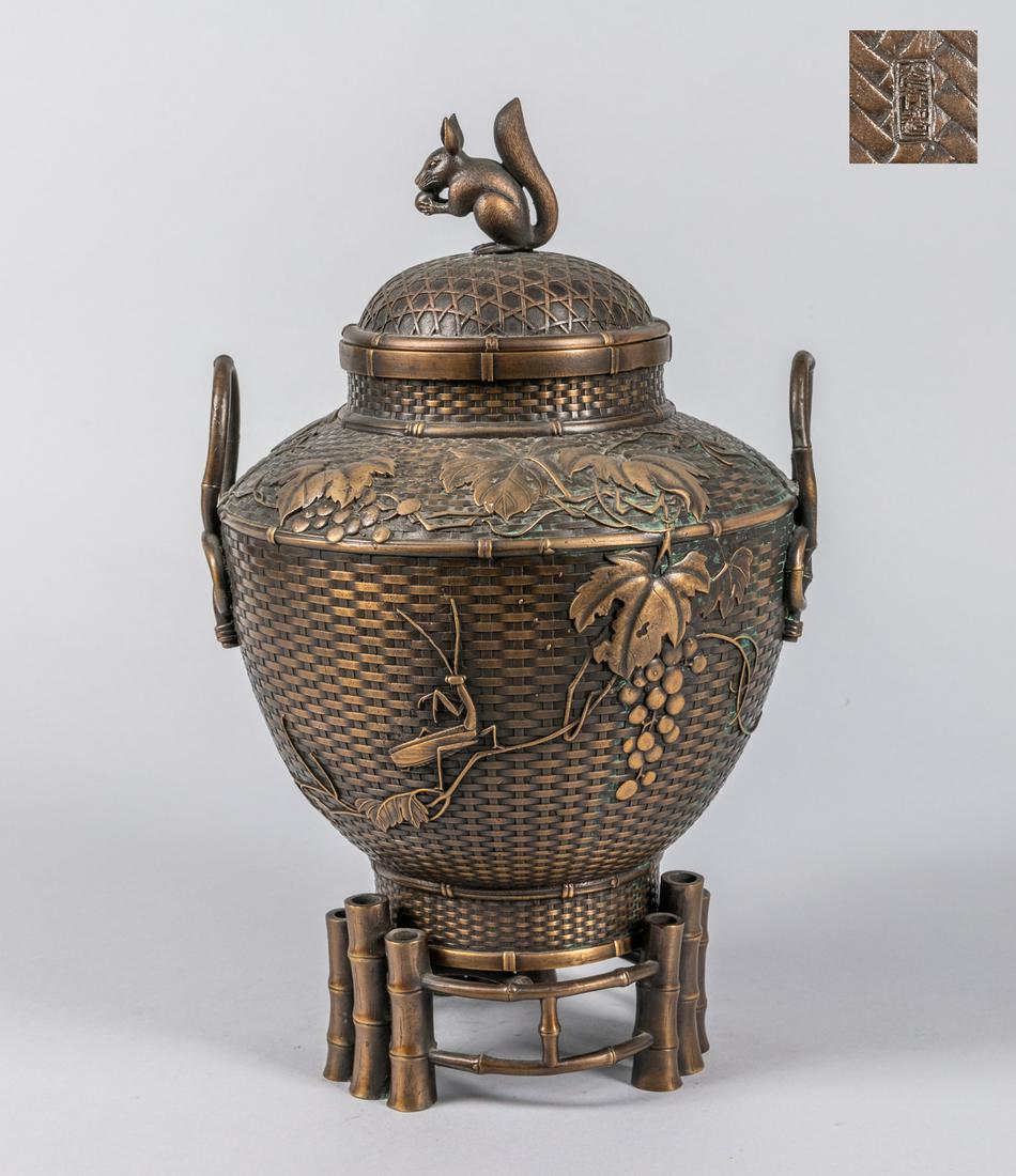 Japanese Old Bronze Vase: Japanese old bronze vase, with a fitted stand, the top covering ending with a squirrel. 12.3*7.3 inch