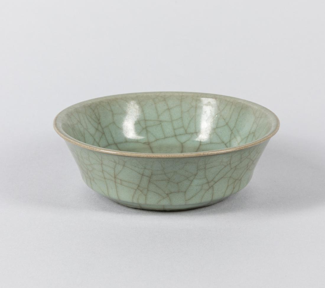 Chinese Antique Celadon Crackle Glazed Bowl: Greenish crackle glazed, with a aged sticker on the bottom. 5.75 inch D, 1.5 inch H