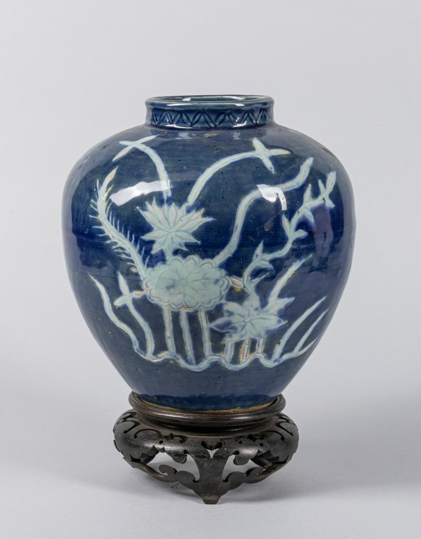 Chinese Antique Porcelain Jar: Applied overall in cobalt blue tone, highlighted with phoenix flying, with a fitted wood stand. 7.8*7.1 inch (without stand)