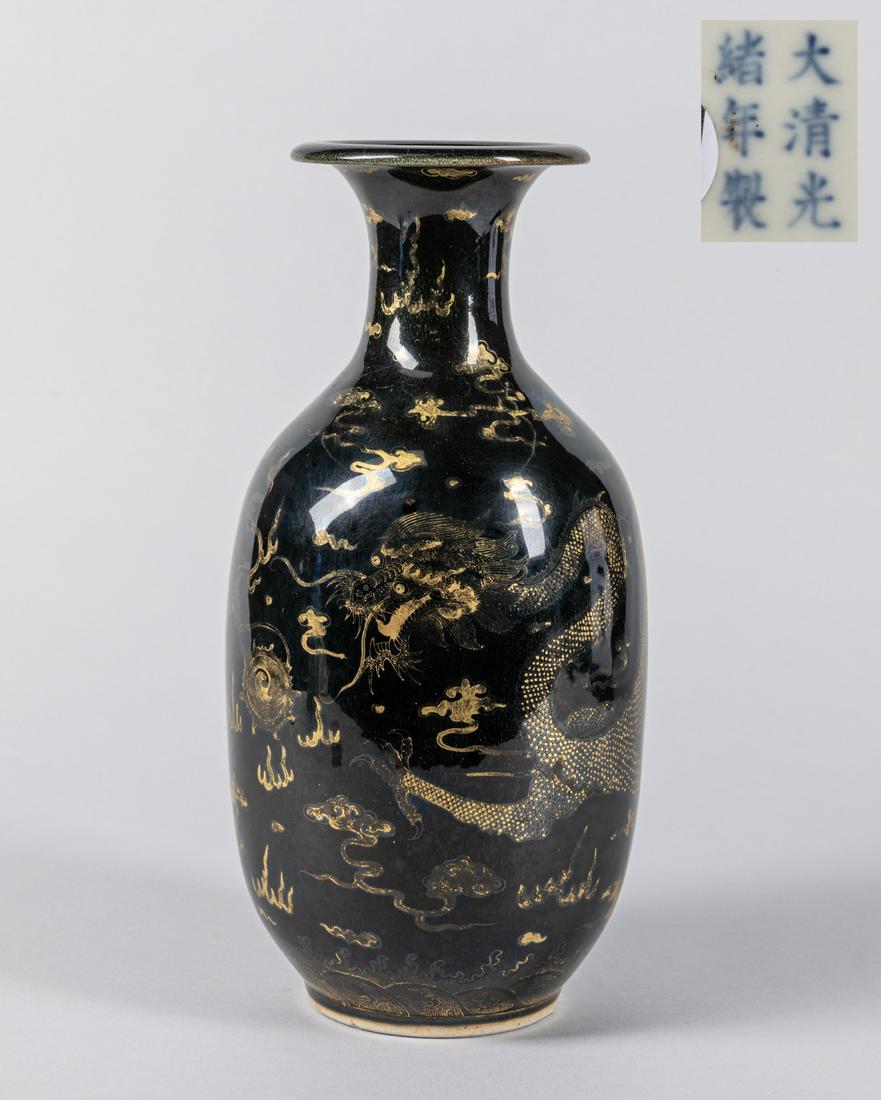 Late 19th Chinese Antique Gilt Porcelain Vase: Applied overall in black glaze, the exterior decorated with a sinuous dragon under gilt tone, the base inscribed with Kuangxu mark. 10.8*4.7 inch