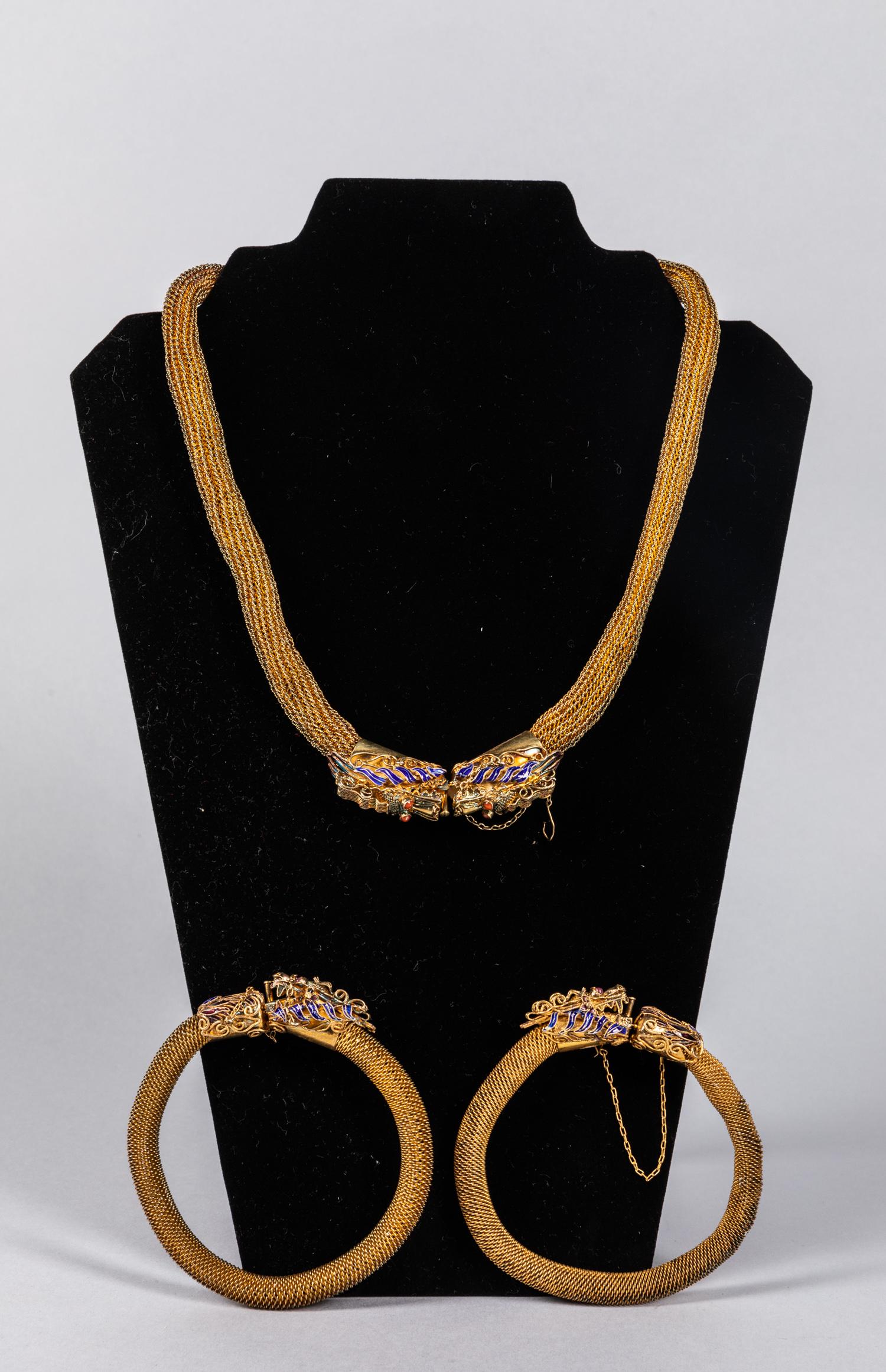 Set of Chinese Antique Silver Bracelet & Necklace: Chinese 1970-80 period export gold on silver. The lot composed by an enameled dragon necklace and pairs bracelet. 3.5 inch D ( bracelet out D ). The Estate of the C.D.Chen, Hong Kong, 1985.