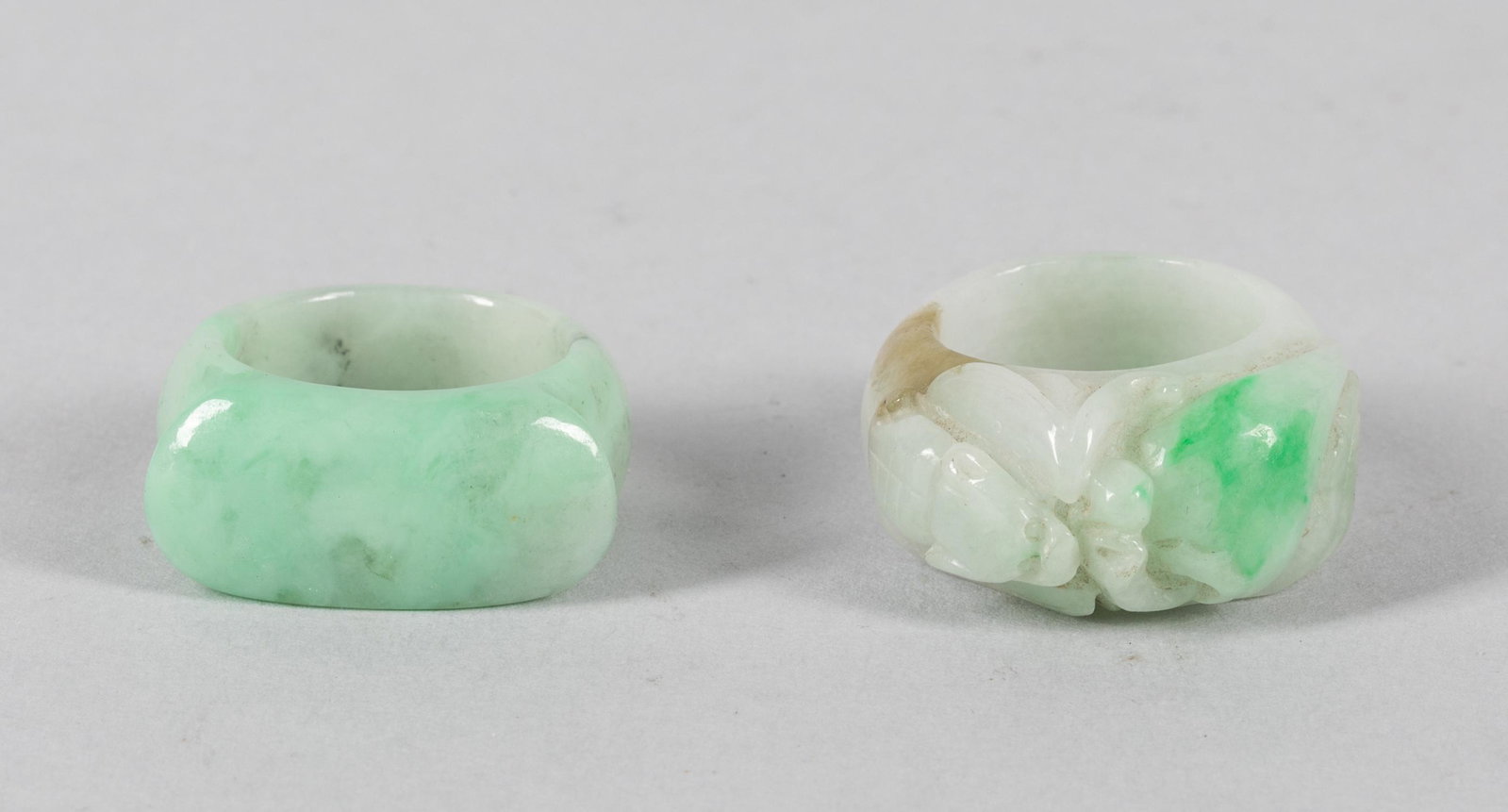 Group old Chinese Jade Jadeite Thumb Rings: Two old carved jade jadeite thumb rings. US size 9/10.