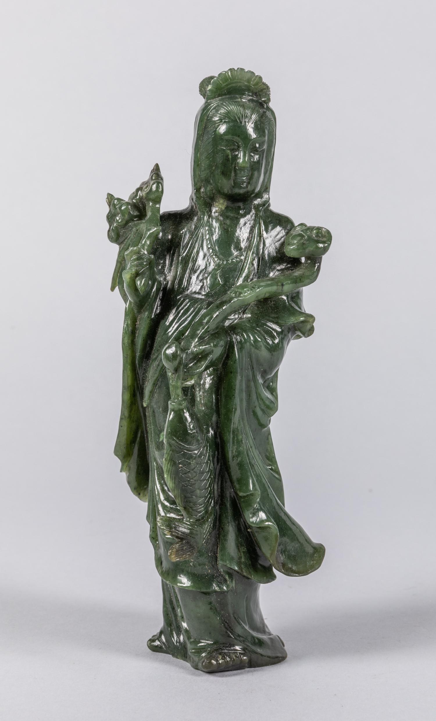 Chinese Antique Spinach Jade Guanyin: The deity wearing long robes, holding a ruyi scepter in one hand. 7.8*3.1 inch