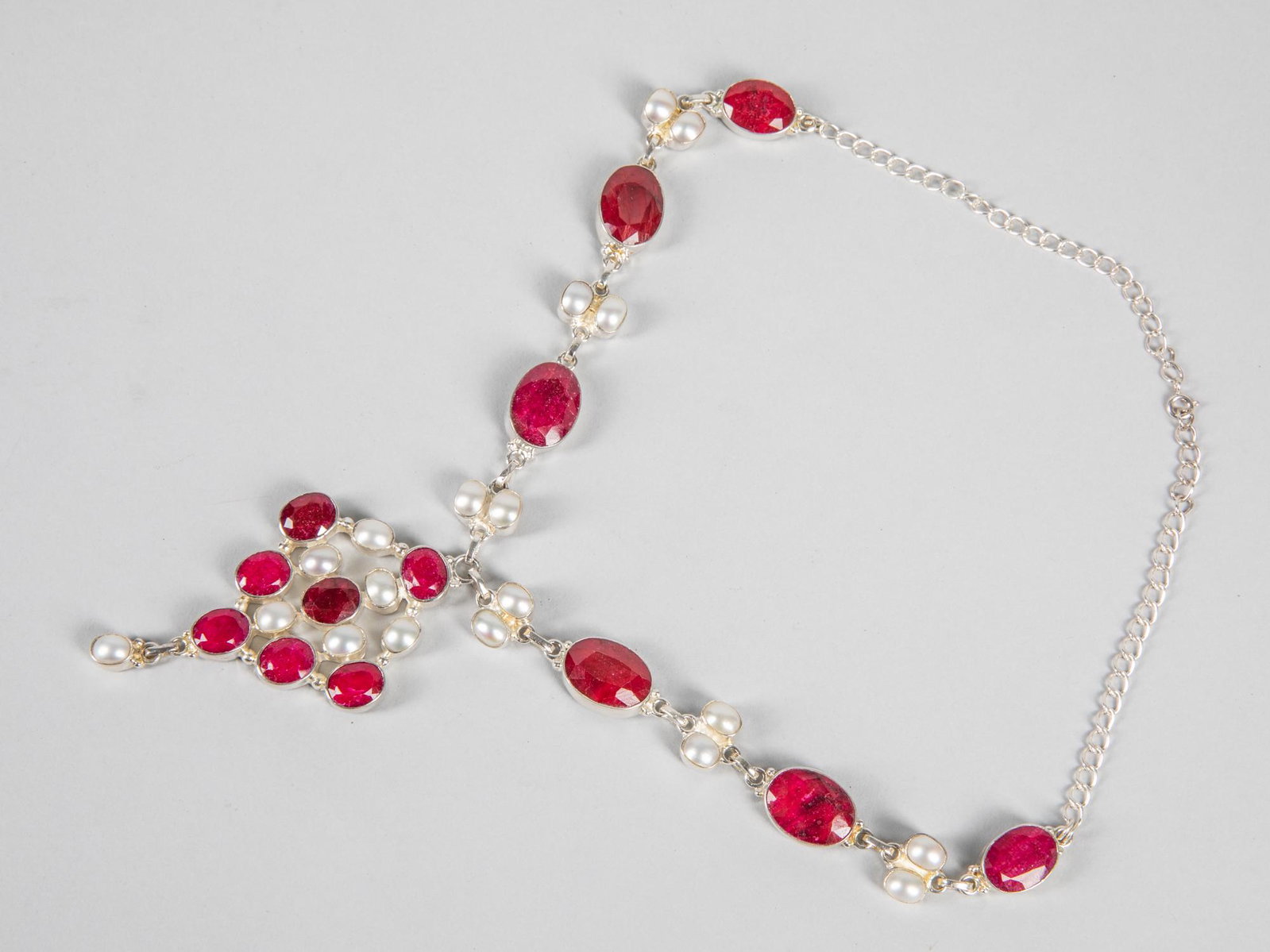 Collectible Art Deco Sterling Silver & Ruby Necklace: 925 mark. Collectible sterling silver necklace composed by ruby like. 11 inch L.