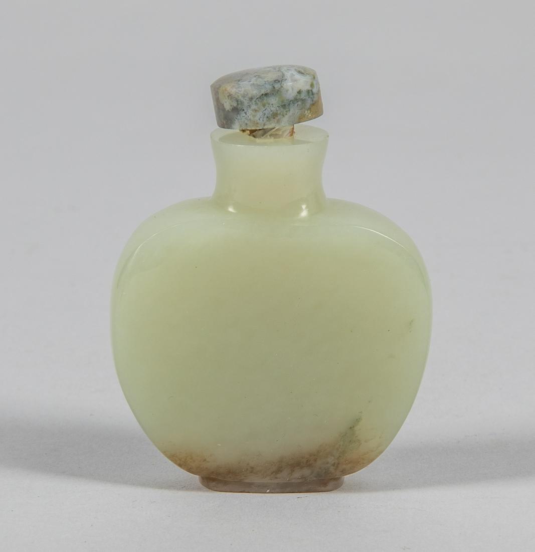 Chinese Celadon Yellow Jade Snuff Bottle: Old Chinese carved pale green jade snuff bottle, of flattened spade form, Moss agate stopper. 2.25 inch H; 1.75 inch W.