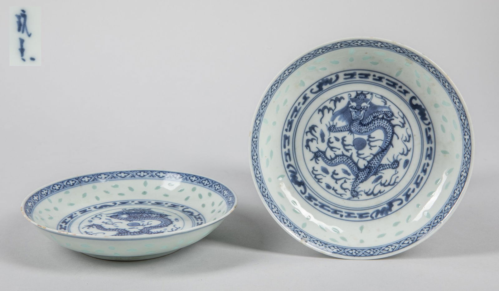 Pairs of Chinese Antique Blue & White Porcelain Dishes: Pairs of two Chinese antique minor chips porcelain dishes, blue & white decorated a dragon in central. 5.5 inch D; 1.2 inch H. The estate of the Matsushita, 1990.