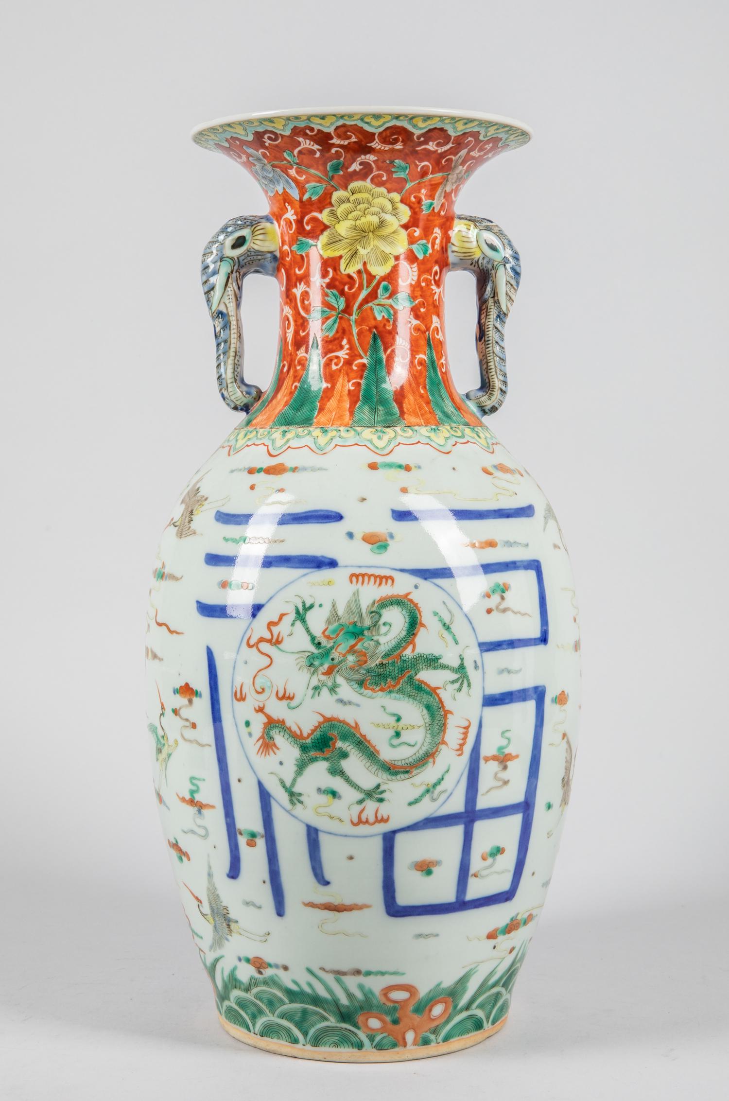Chinese Antique Famille Rose Porcelain Vase,1880-1930: The ovoid body decorated with two panels, encircled by a four-claw scaly dragon amid clouds and crashing waves, cranes flying surrounded, between a border of pendent foliate leafy floral bloom, and a