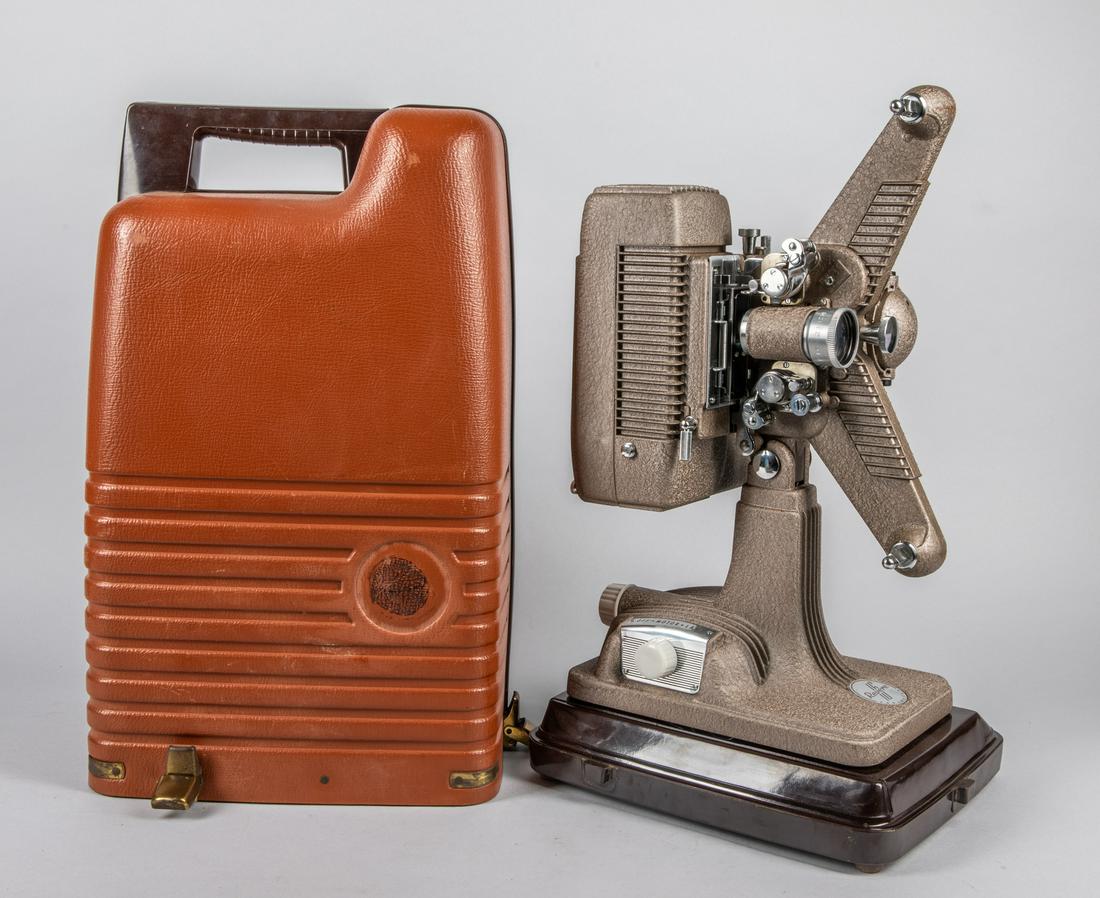 Collectible Revere 16mm Movie Projector: 16mm. F1:1.6, 2 inch. Works well. With original case. 19-10.5-8 inch.