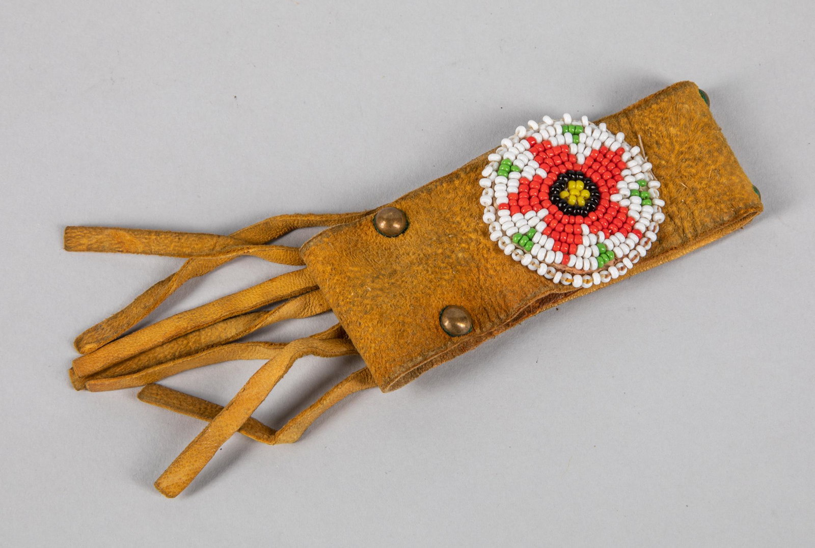 Navajo Bead Star Bracelet: Navajo bead star bracelet on leather with fringe. 8.3 inch L