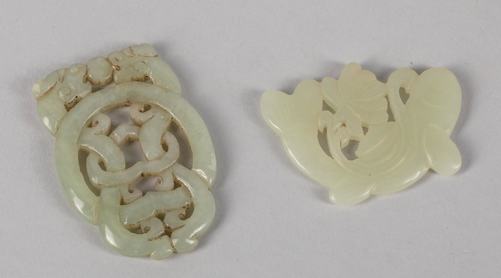Chinese Jade Carvings: Group of Chinese jade carvings, two open works carved jade plaques. 1.7-2.4 inch . (largest). The estate of the East Los Angeles, CA, 2020.