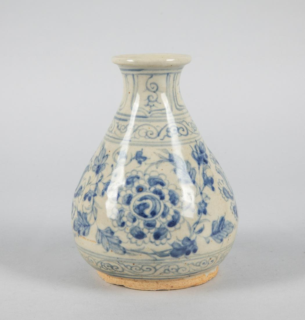 Vietnamese Hoi An Blue & White Porcelain Vase: Vietnamese Hoi An blue & white porcelain decorated vase with flowers. 6 inch H; 4.5 inch W. The Estate of the Dr. Nguyen 1982.