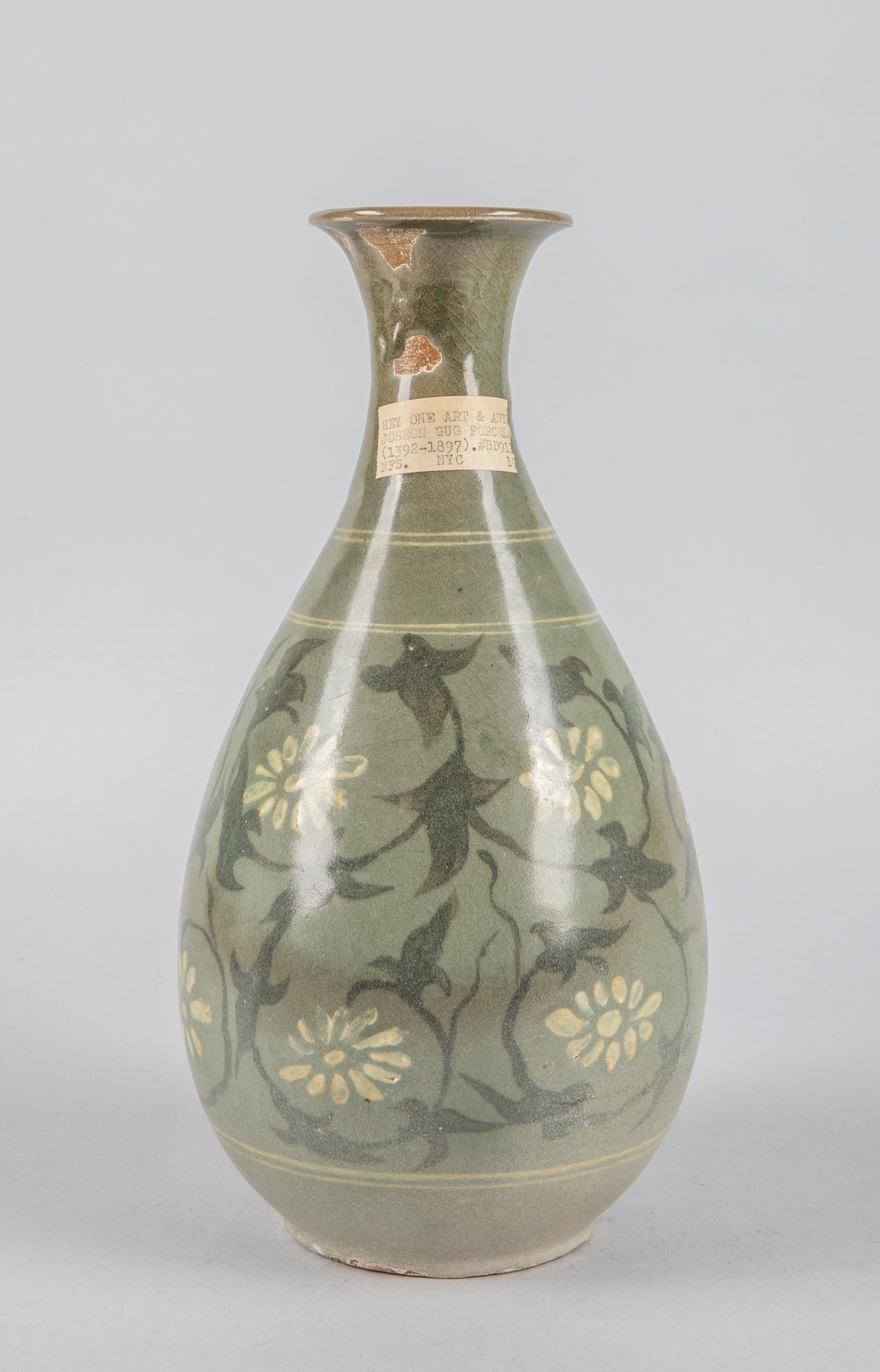 Tall Korean Joseon Celadon Glazed Porcelain Vase: Korean old Joseon porcelain vase, minor chips on glazed, celadon color decorated with flowers. 12 inch H; 6 inch W. The estate of Chunwoo King, Tokyo, 2002