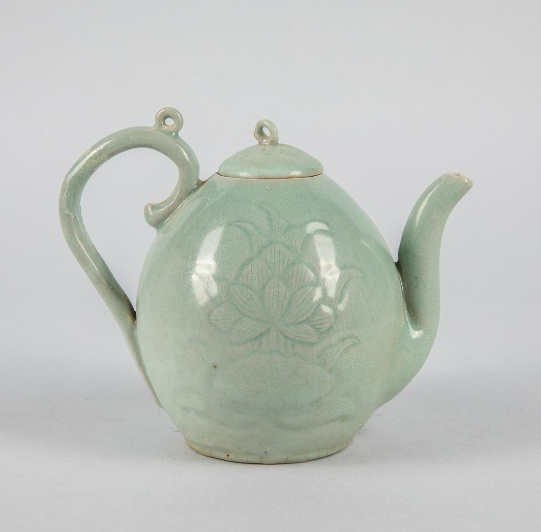 Korean Pale Celadon Glazed Porcelain Pot: Korean pale celadon pot, decorated with lotus. 5.5 inch H; 6.5 inch L. The estate of Mitsui, 1995.
