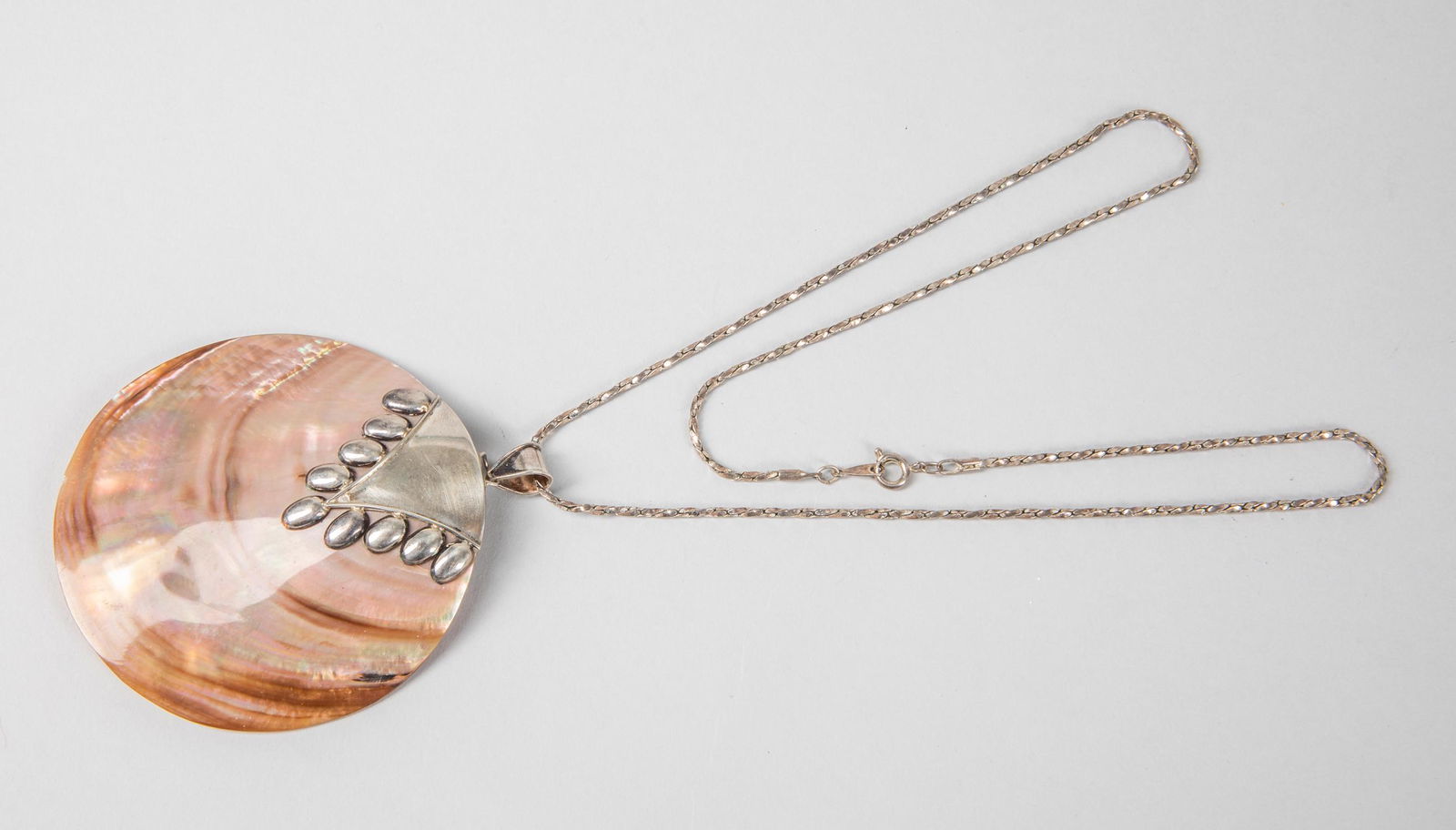 Large Mother of Pearl Abalone Pendant: Large mother of pearl abalone sterling pendant with chain. 3.08 inch diameter