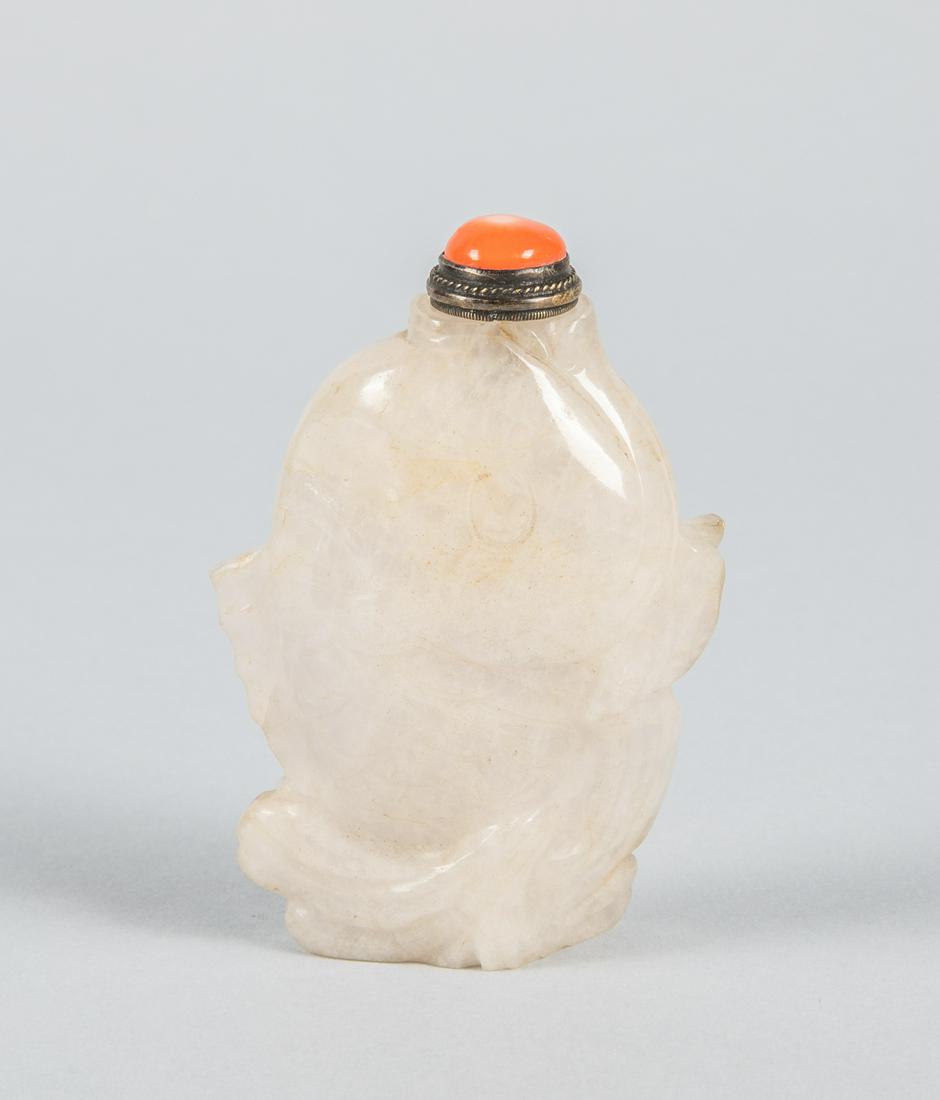 Chinese Jadeite Carving of Snuff Bottle: Chinese jadeite carved snuff bottle of fish type. Coral like stopper. 3.2 inch H; 2.25 inch W.