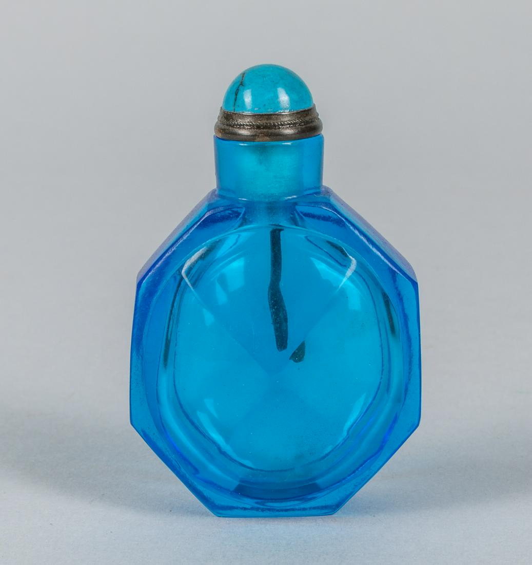 Chinese Sapphire Like Glass Snuff Bottle: Old Chinese sapphire like pecking glass snuff bottle. 1.75 inch W; 2.75 inch H.