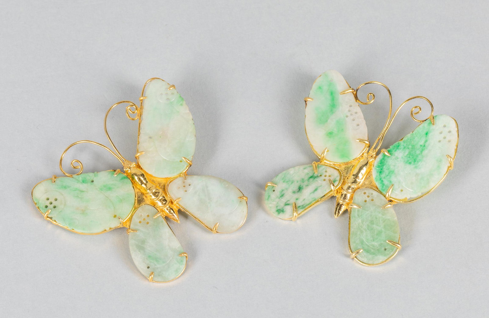 Set Chinese Gold on Silver Jadeite Brooch: Set of two Chinese brooch, gold on silver, with carved jadeite. Butterfly type. 2.1-2.1 inch.