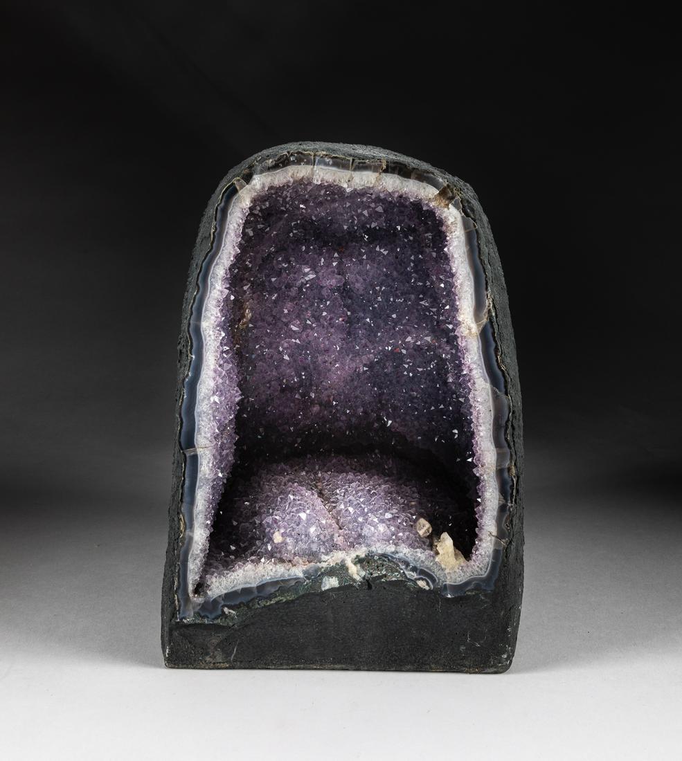 Fine Brazil Amethyst Geode: Amethyst is the purple variety of quartz and is a popular gemstone. The name "amethyst" comes from the Greek and means "not drunken." This was maybe due to a belief that Amethyst would ward off the ef