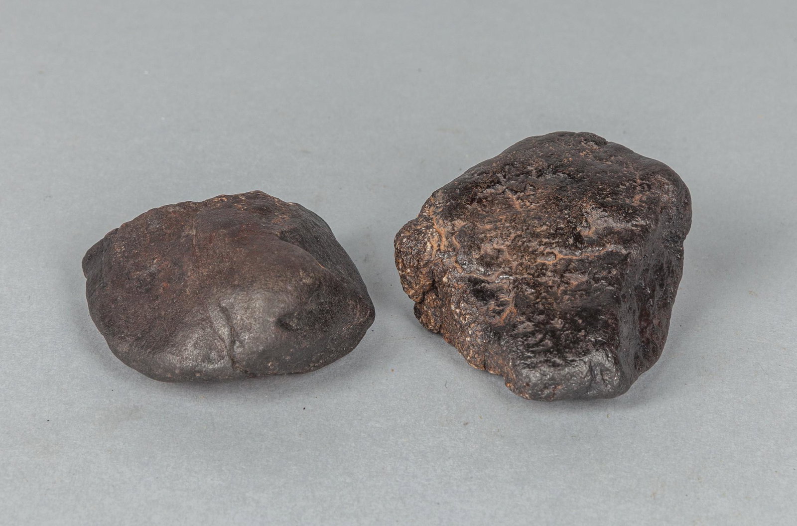 Set of Collectible Meteorite Stones: Set of two collectible meteorite stones. 287.2g, 2.5x1.75 inch.