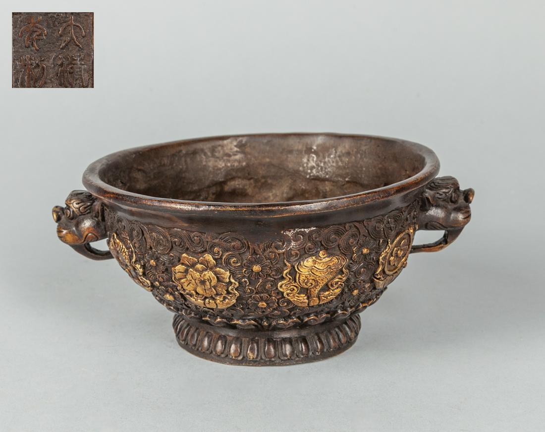 Chinese Carved Bronze Incense Burner: Chinese carved bronze incense burner decorated with fish and lotus, four characters mark, the rim is not on even level. 5.5 inch D. The Estate of the J. P. Chen, HK, 1999.