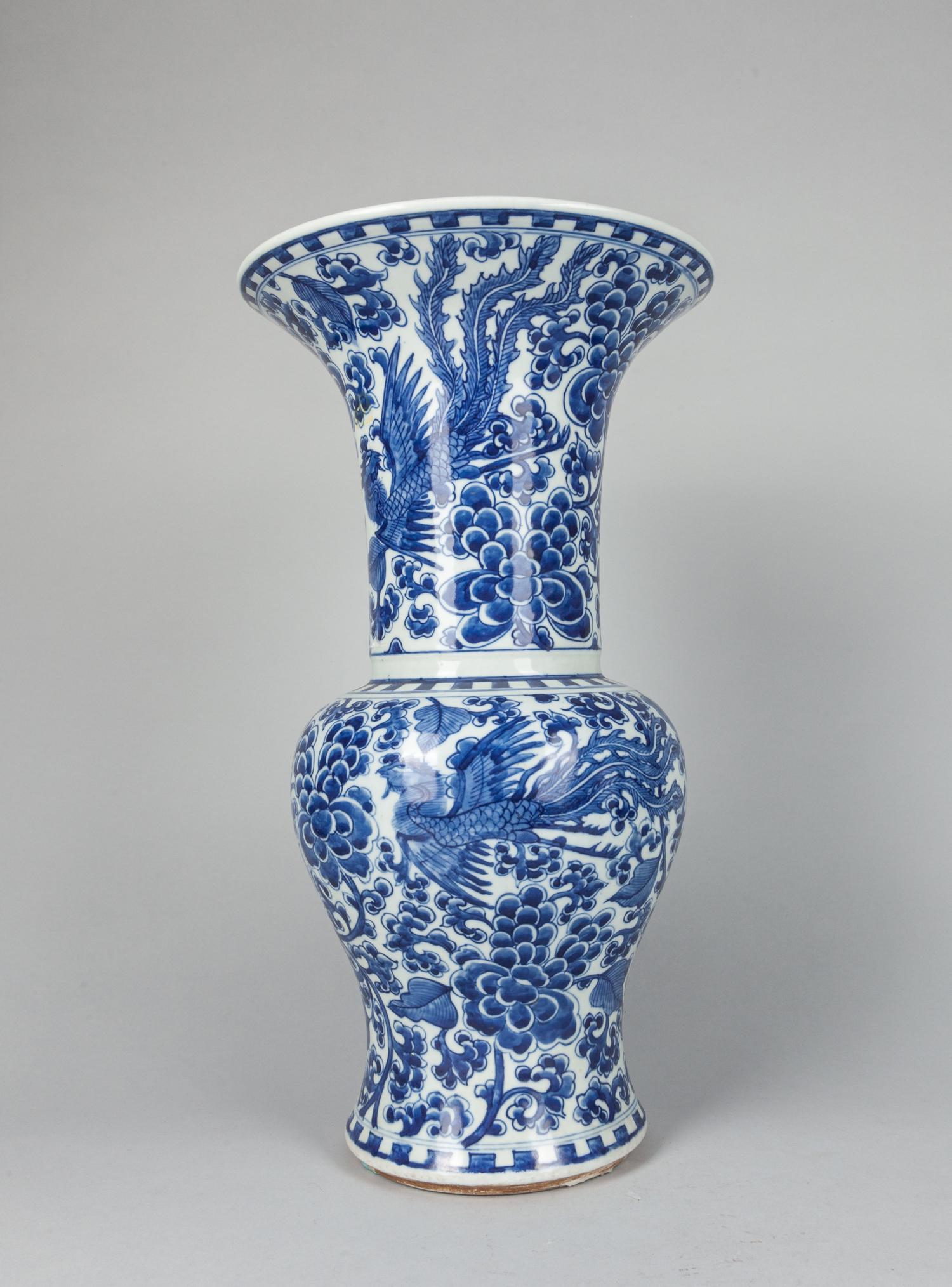 Chinese Blue & White Porcelain Vase: Tall Chinese blue and white porcelain vase decorated with flowers and phoenix, minor chip at the inner neck. 9.5x17.25.