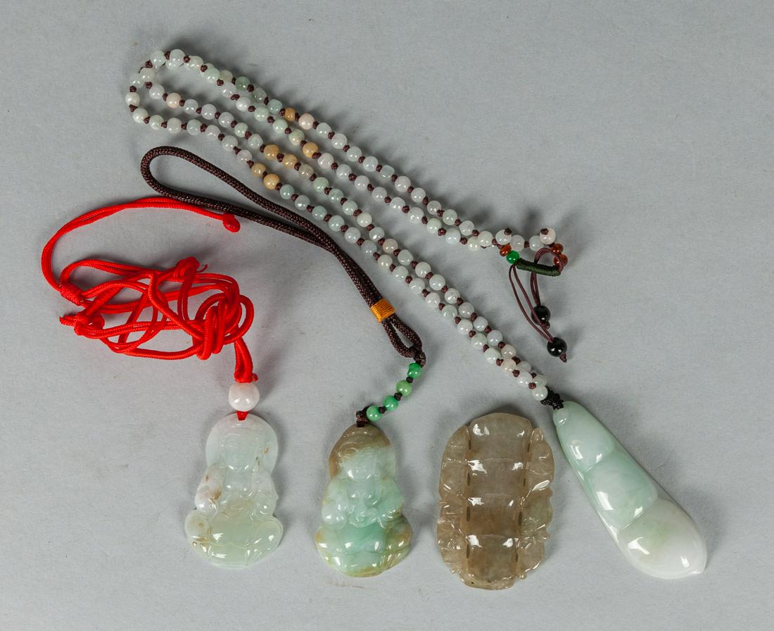 Group of Chinese Jadeite Stone Carvings: Group of four jadeite carvings of pendants. 2.25 inch(largest).
