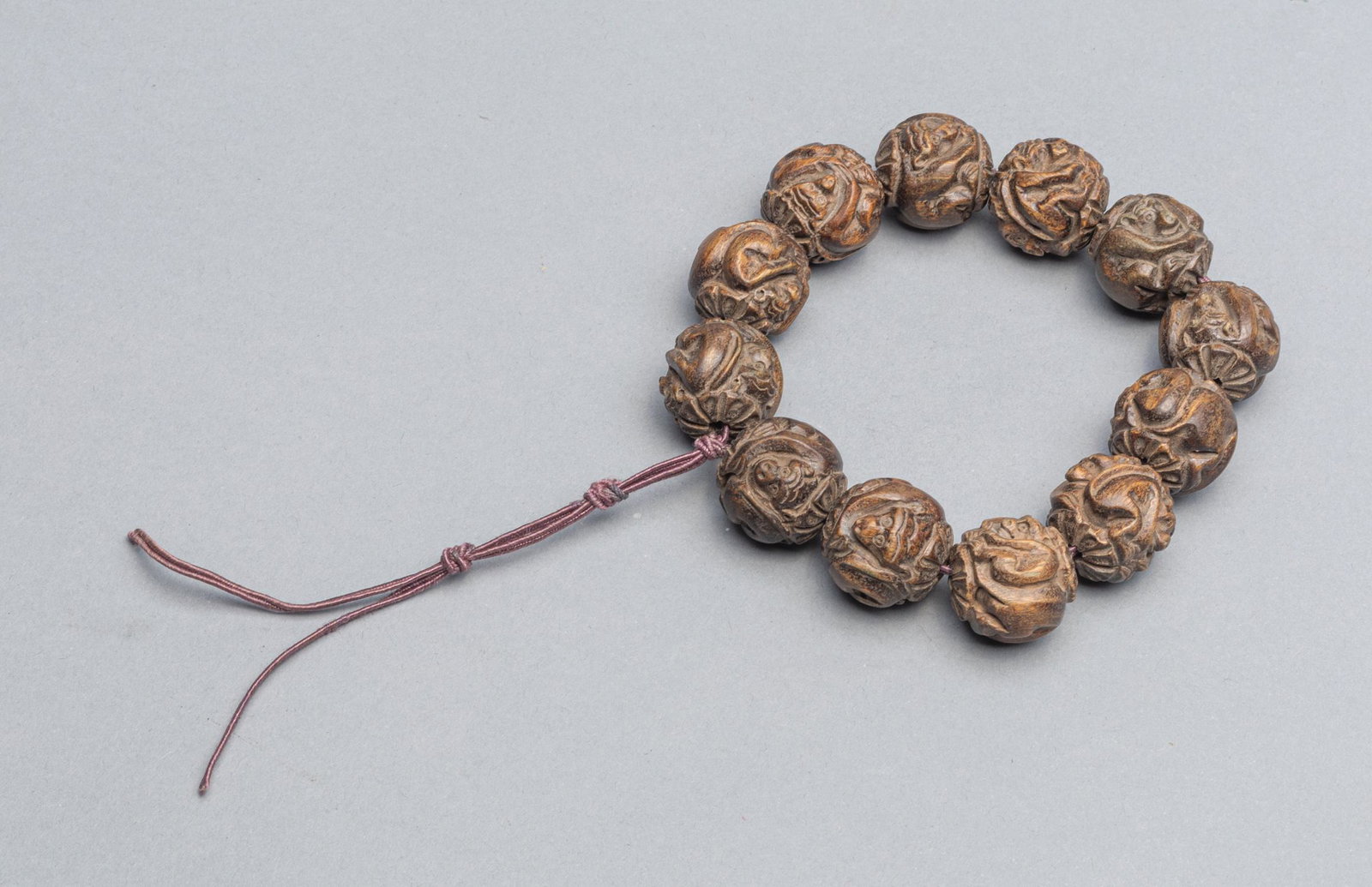 Large Size Chinese Export Agarwood Prayer Beads: Fine 12 large size export agarwood prayer beads carved in monkey shape. 0.89 inch L (largest beads). The Estate of the Yaotome, Long Beach, CA, 2000.
