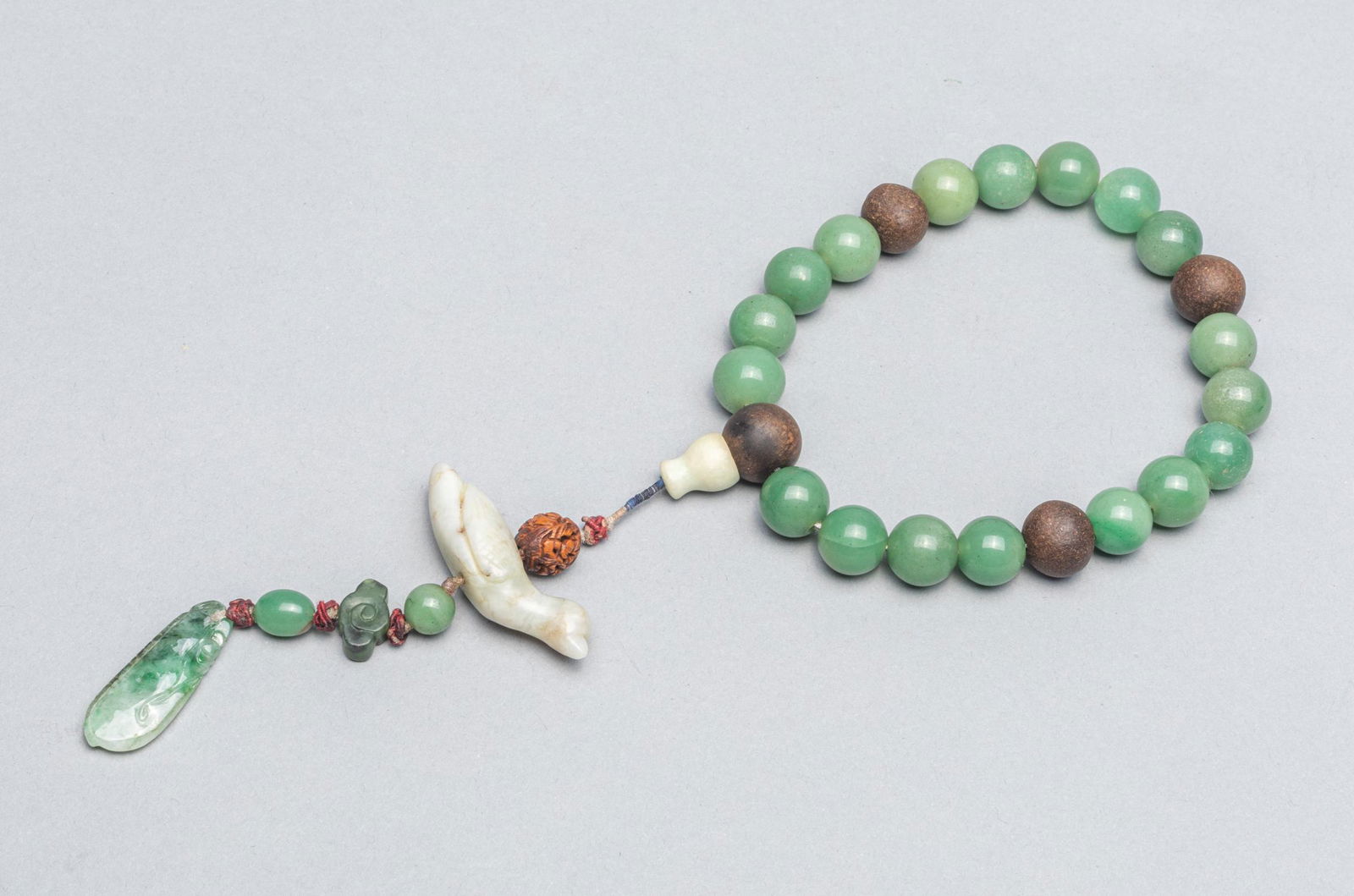 Chinese Antique Jade & Wood Prayer Beads: Antique jade & wood prayer beads with carved wood, bird and fruit shape jade pendant. 0.52 inch L (largest beads); 88g. The Estate of the Yaotome, Long Beach, CA, 2000.