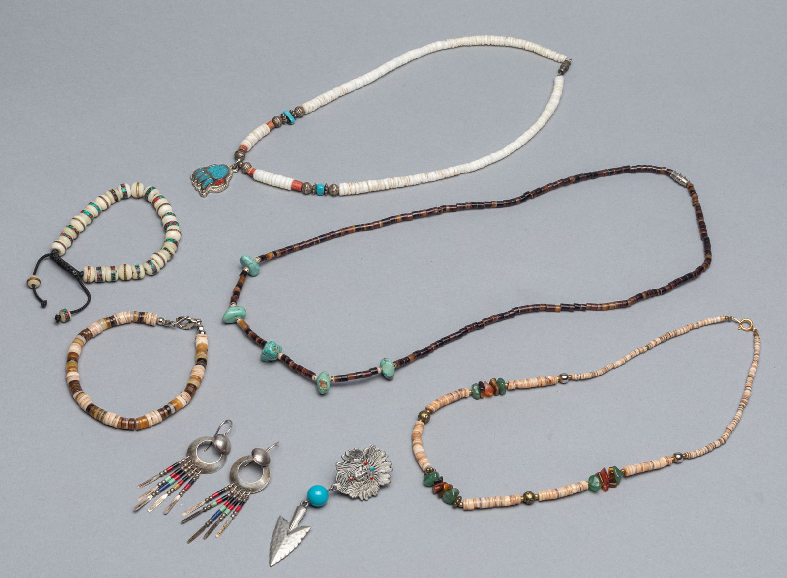 Group Native American Type Trade Bead Necklace and: Group of 7 Native American Type items, 3 trade shell bead designed necklaces, one silver Earrings, one pewter Indian pendant, two shel and bone bracelets. 25 inch L. Private Collection from Los Angele