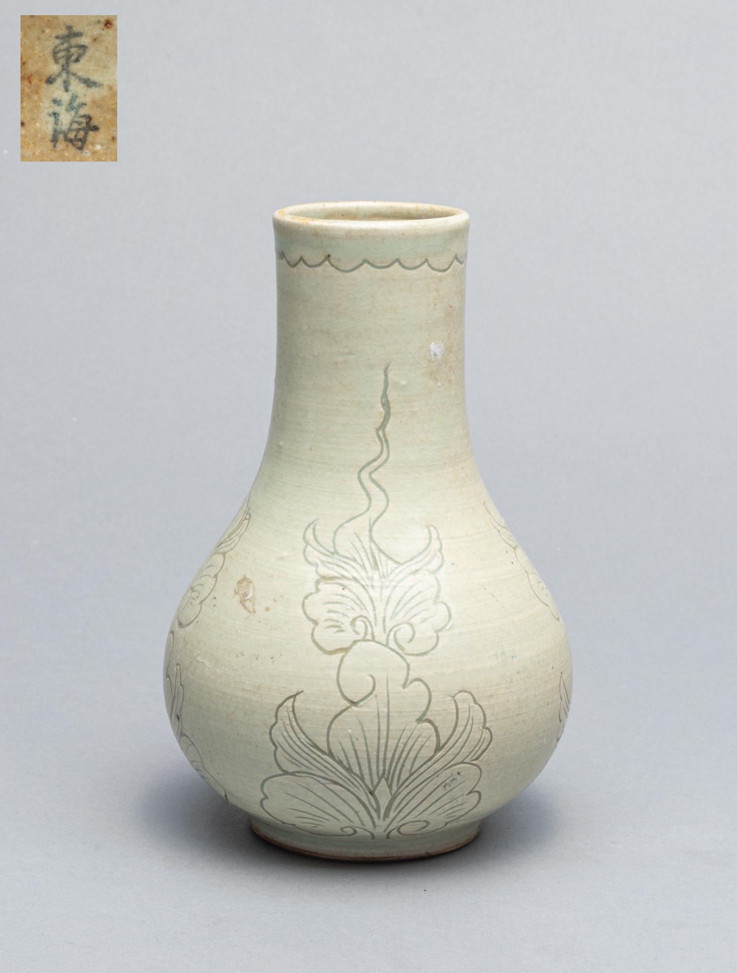 Korean Celadon Porcelain Cabinet Vase: Fine Korean celadon porcelain cabinet vase, the exterior carved with floral pattern. 6.5 inch H; 4.2 inch W.