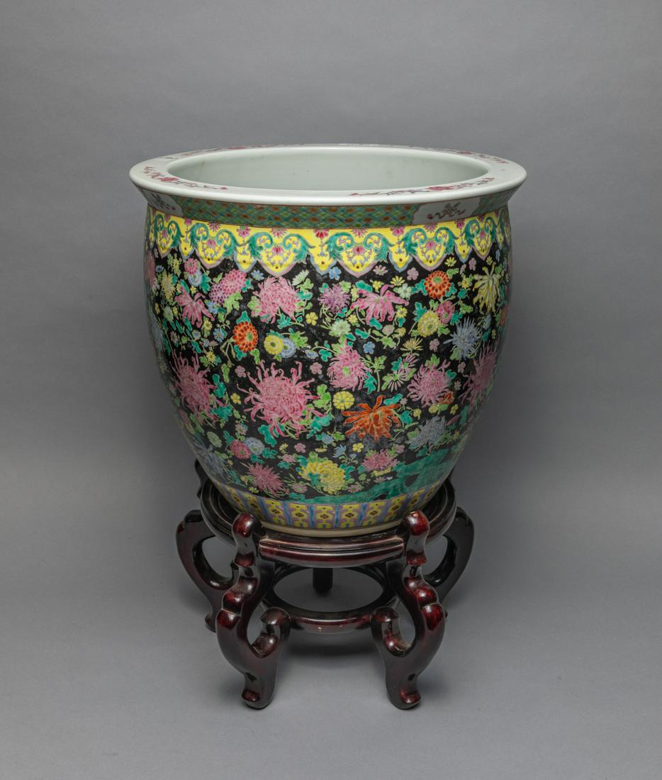 Large Chinese Famille Rose Porcelain Pot: Fine large Chinese famille pose porcelain pot painted in chrysanthemum flower and archaistic pattern; interior base painted goldfishï¼Œ with a wood stand. 15.75 inch D; 14 inch H. (without stand)