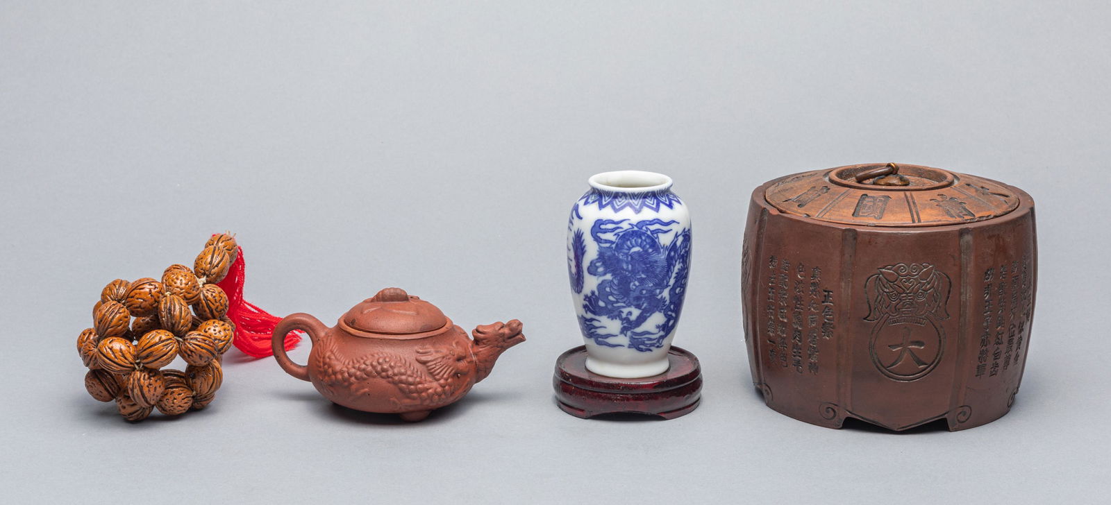Set of Chinese Zisha and Porcelain Wares: Set of four Chinese Items, two zisha wares, one blue and white vase, one nuts beaded ball. 4.5x3.5 inch(largest).