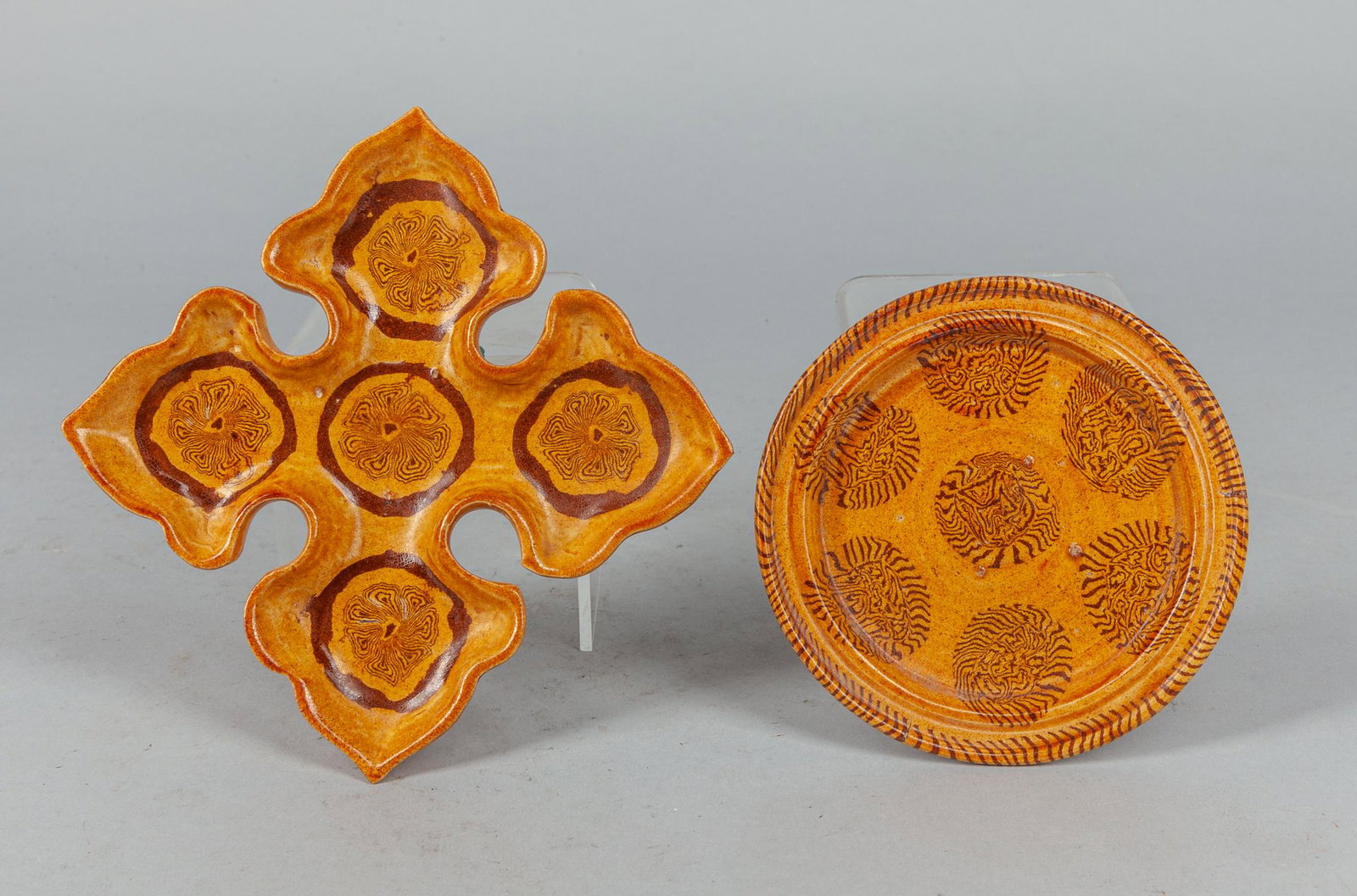 Set Chinese Glazed Pottery Plates: Set of two Chinese Tang type glazed pottery plates in yellow and brown color. 4.15*4.3*1.4 inch (total). The Estate of the Steven Chang Art, SF, 1995.