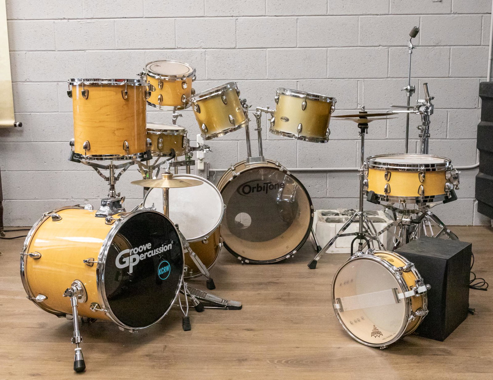 Group of Assorted Drums/Speakers: Group of assorted drums with stands, petals and speakers. 9*18.25 inch (largest)