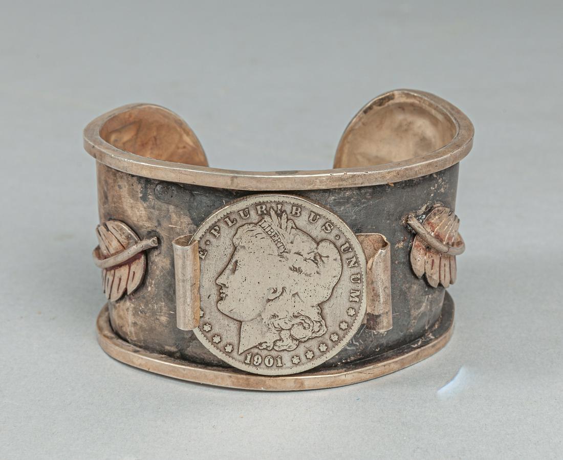 LG Navajo Designed Silver & Morgan Coin Silver Bracelet: Vintage cuff bracelet with marked 1901 Denver Morgan silver dollar. native American type with feather shape design. Bracelet measures 1.75 inch of height and 3.25 inch of diameter.126.2g.