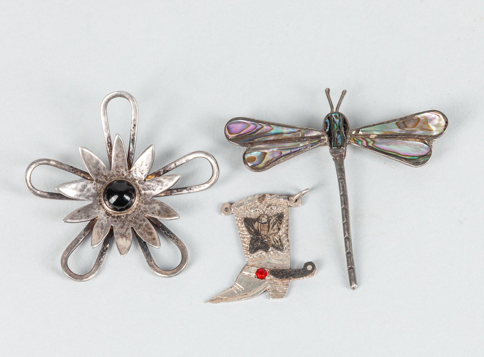 Set Vintage Sterling, 14k Brooch: Group of antique Roman eye type glass beads: one marked 925 dragonfly brooch inlaid MOF; one marked sterling, 14k Mexico shoe; one silver flower type brooch with gem stone. 20g (total)