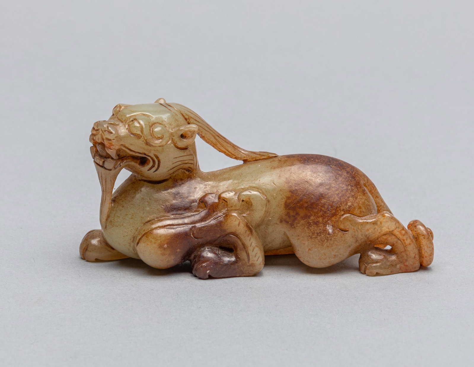 Chinese Brown Color Jade Carving of Beast: Chinese brown color jade carving of beast in seating position. 3.82*1.77 inch. The Estate of Los Angeles Antique Store Closed Sale, 2020.