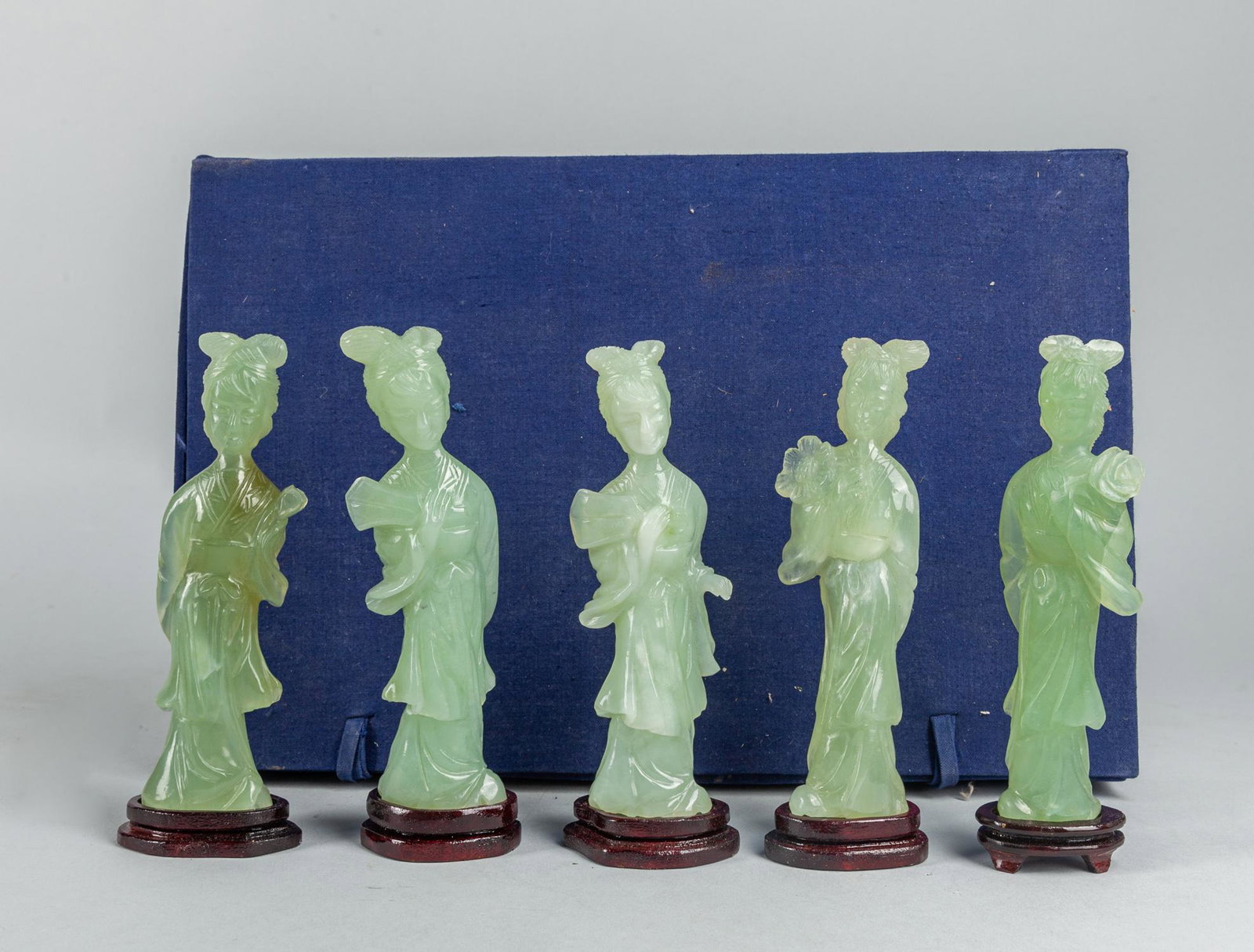 Set Chinese Export Translucent Jade Carving Of Figures: Set of five Chinese export translucent jade carving of figures in pale celadon tone, with wood stand. 5.6*2 inch (each). The Estate of the Steven Chang Art, SF, 1995.