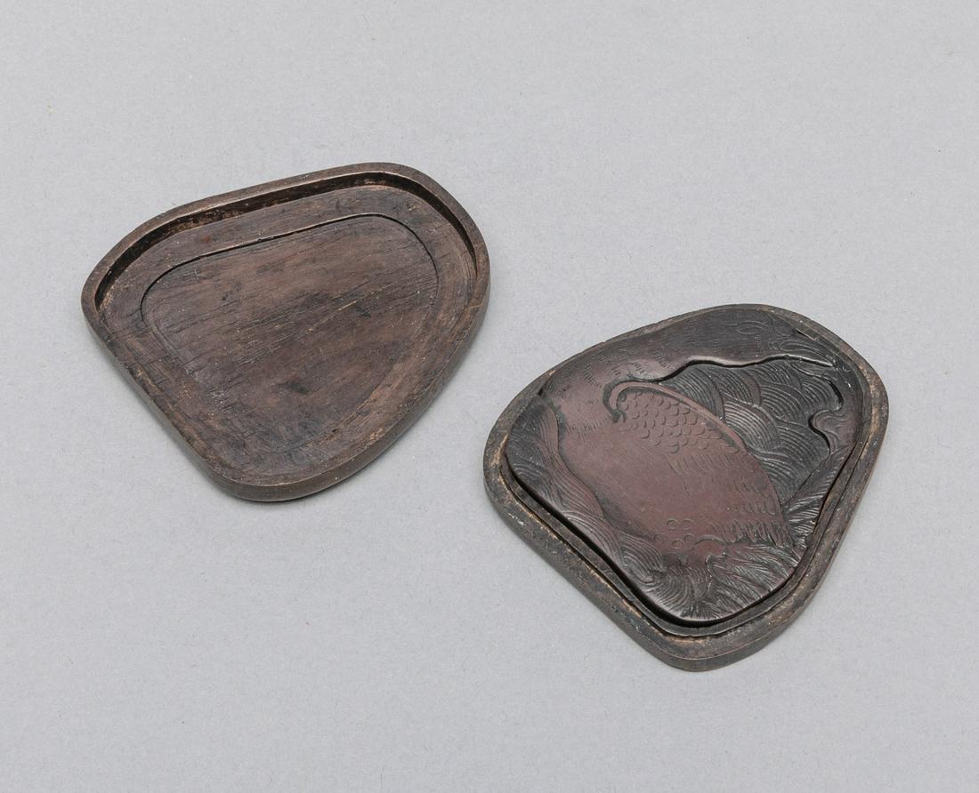 Chinese Carved Covered Ink Stone: Chinese carved covered ink stone, depicting a scene of goose in the water, with fitted wood case. 2.75*2.55 inch.