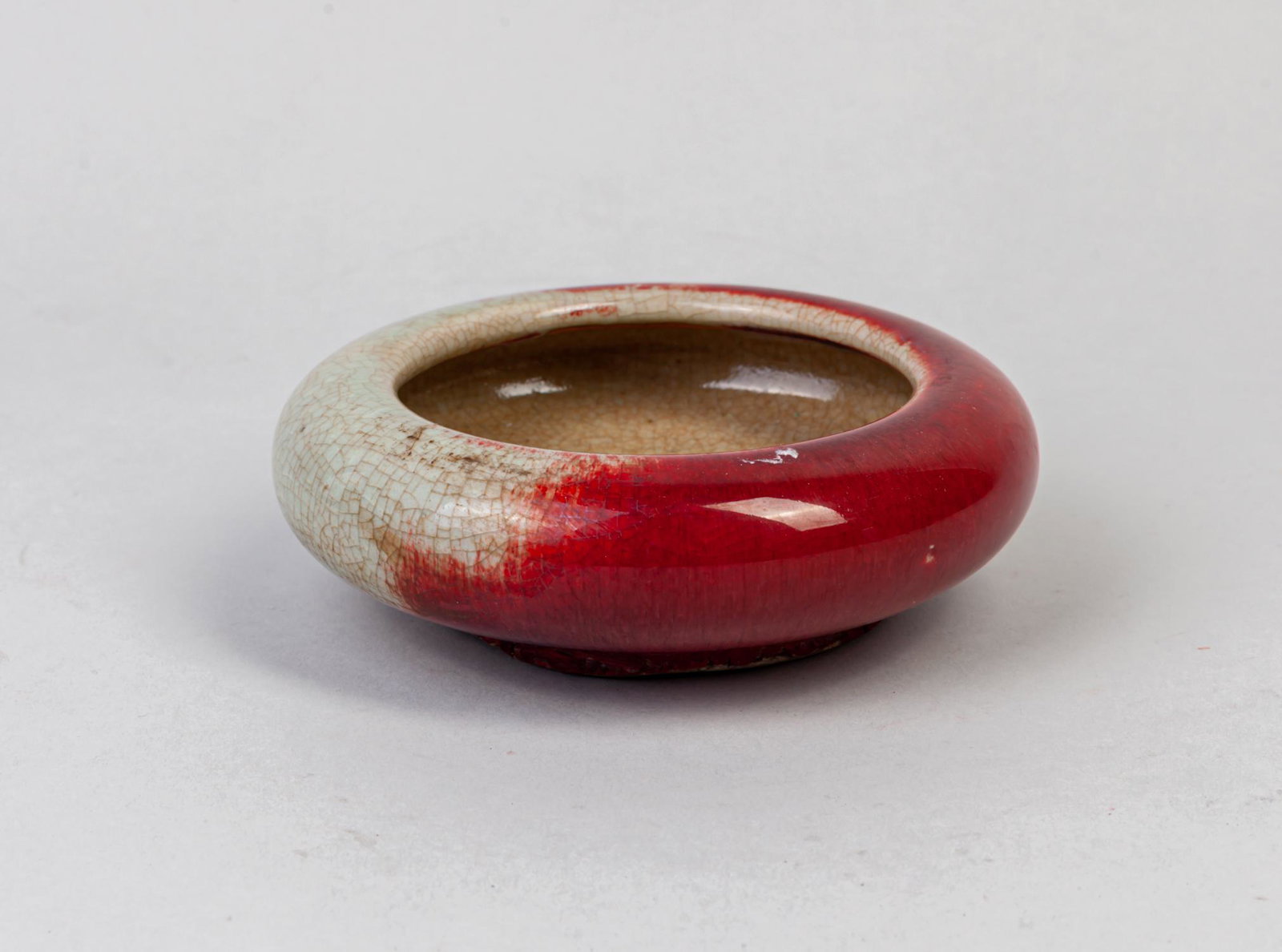 Chinese Old Flambe Glazed Porcelain Washer: Chinese flambe glazed porcelain washer, the glaze transmuting from celadon tones to rich red tones to the exterior, overall with natural crackles. 5inch D, 1.7inch H.