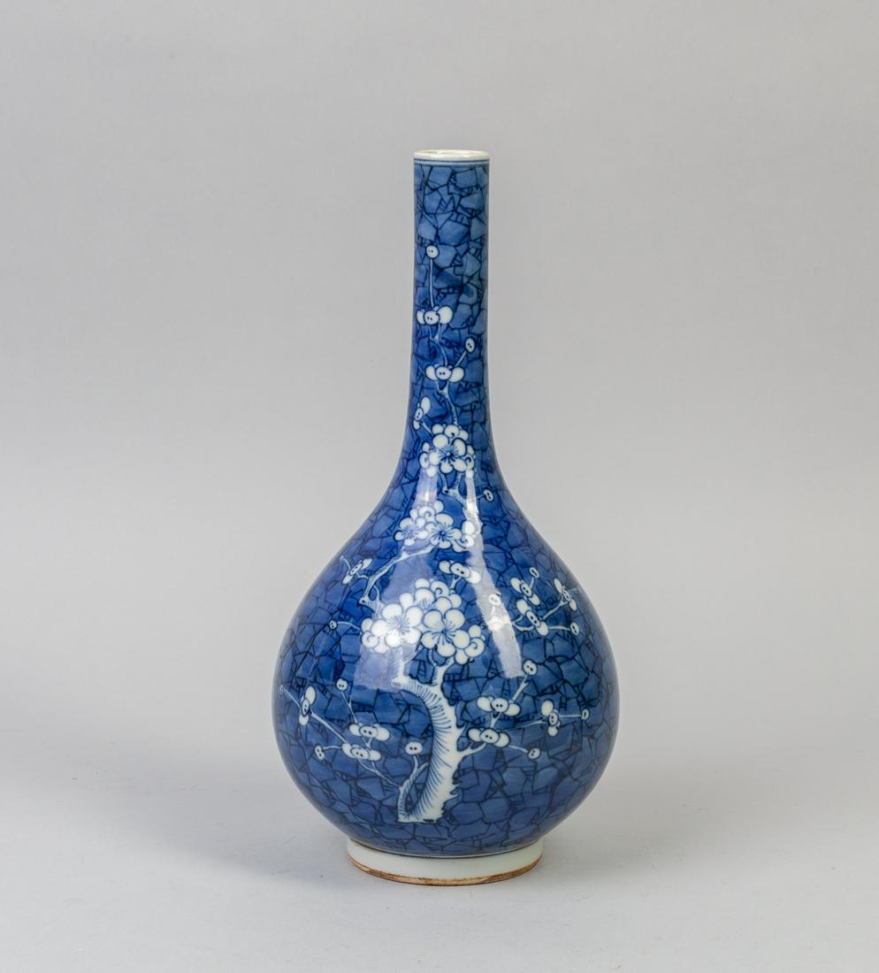 Chinese Export Blue White Porcelain Vase: Chinese export blue and white porcelain vase, the globular body rising from a straight foot to a tall cylindrical neck, decorated with plum blossoms on ground with crushed ice pattern, base with doubl