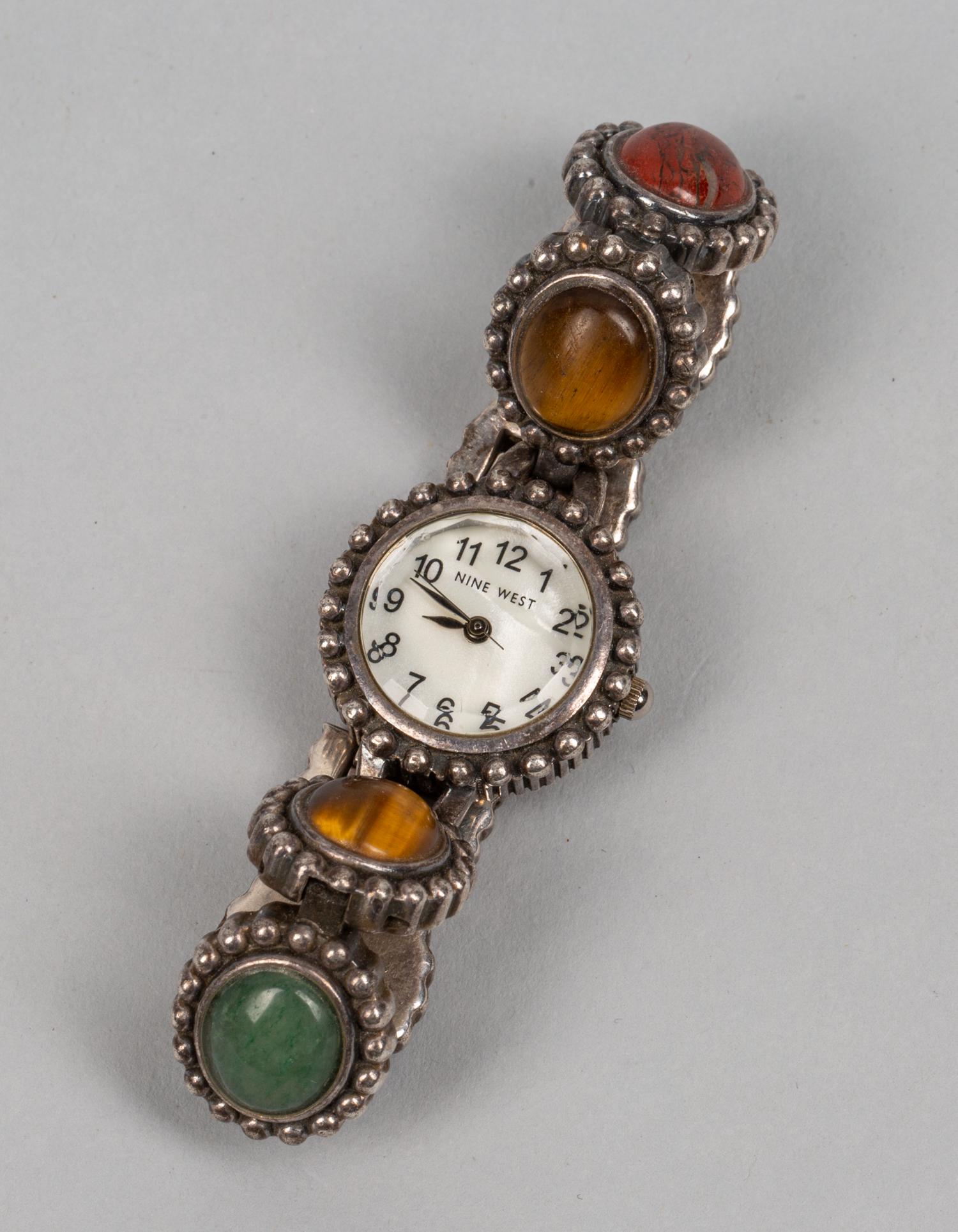 Japan Designed Nine West Gem Stone Watch: Japan designed nine west gem stone watch, works watch marked base metal bezel stainless steel back, link marked China. 0.94 inch D (clock), 6 inch L.