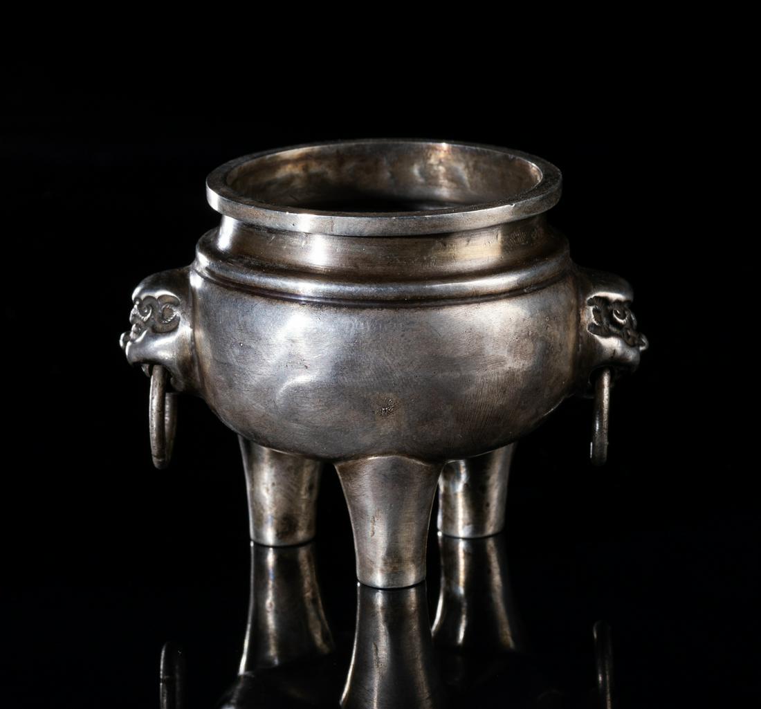 Japanese Meiji Silver Cabinet Censer: The compressed globular body supported on three feet to a short waisted neck and flat rim, flanked by a pair of beast face, suspended with a mock ring. 2.7*2.1 inch ; 72g