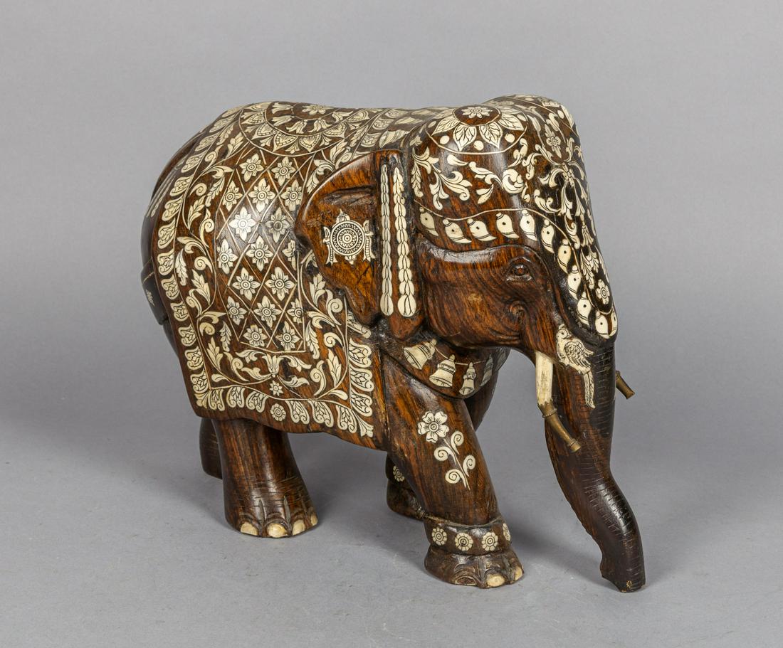 Large Asian Decor Wood Elephant Sculpture Inlaid Bone: A large wood elephant-shape sculpture, inlaid with bone as flower blooms, coiling foliages, bells, and birds. 11.9*10.1*4.8inch.