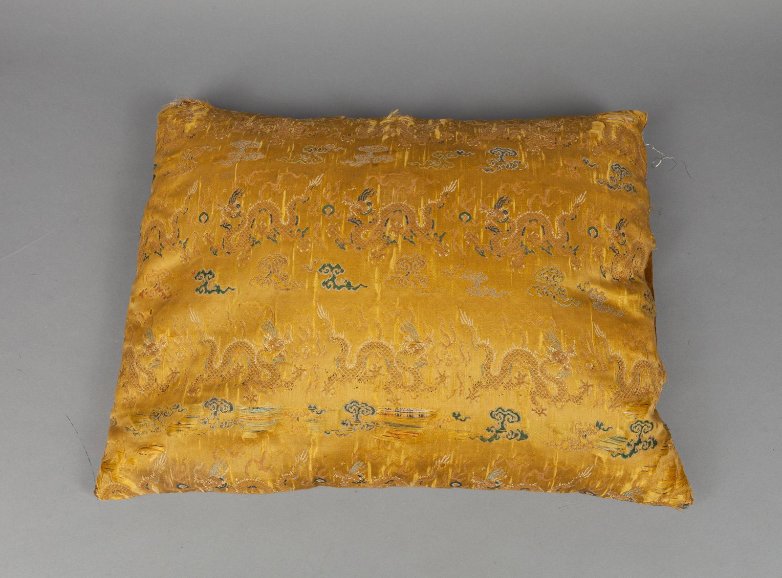 Chinese Old Embroidered Dragon Pillow: Chinese old pillow embroidered with striding dragons pursing flaming pearls among flames and clouds, overall in gold tone. 20.5*15.7inch.
