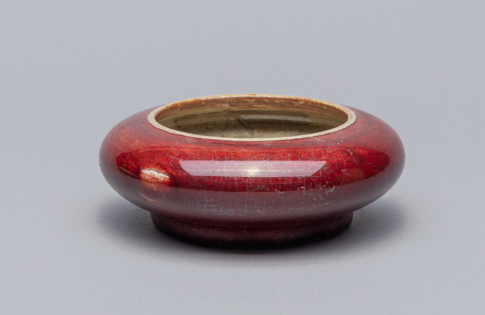 Chinese Flambe Glazed Porcelain Brush Washer: Of compressed globular form, the exterior applied with a deep red flambe glaze. 4.46*1.57inch.